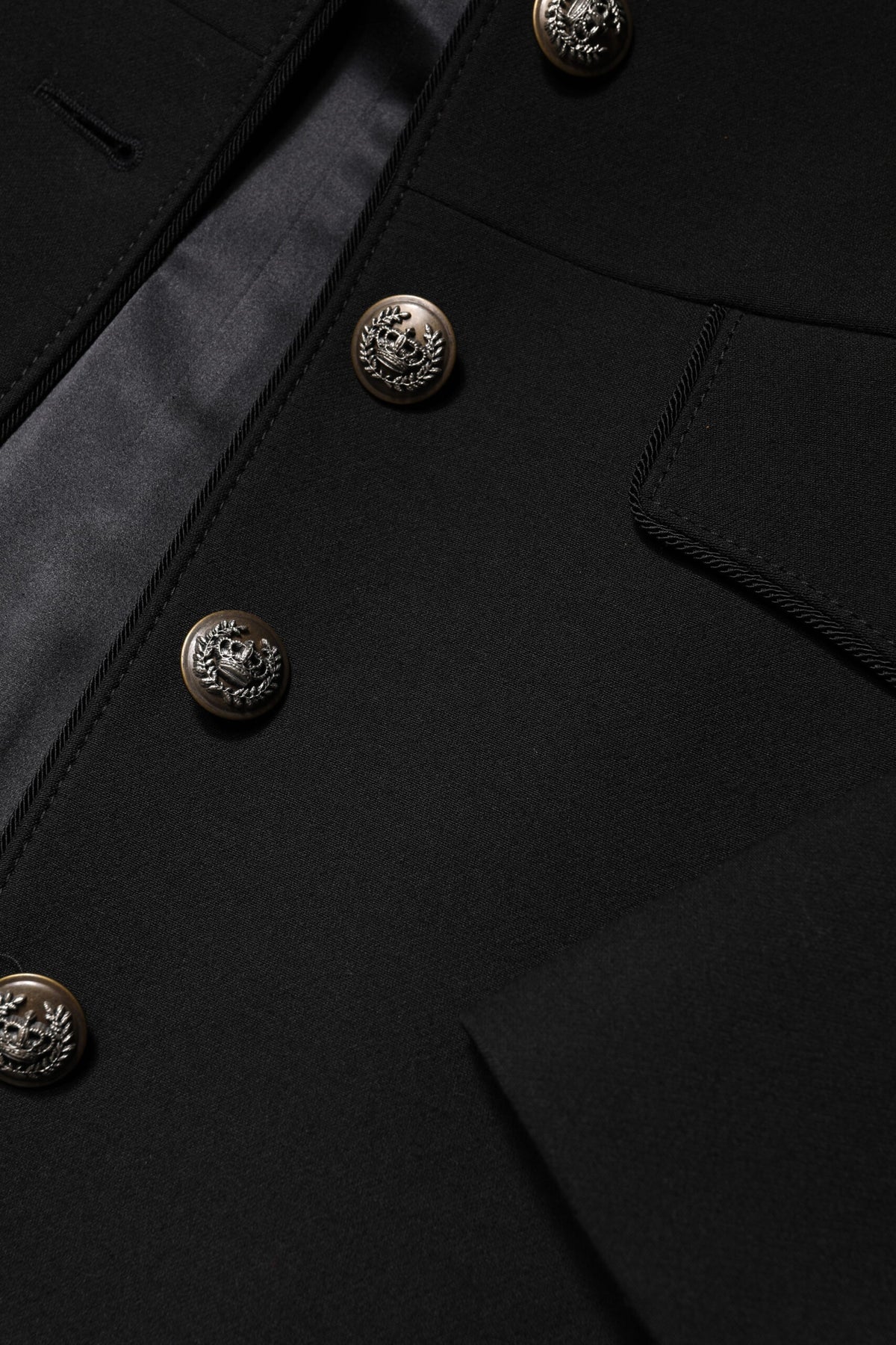 Elevate your wardrobe with the Dolce & Gabbana Black Wool Single Breasted Trench Coat, a masterpiece of Italian craftsmanship blending luxury and sophistication.