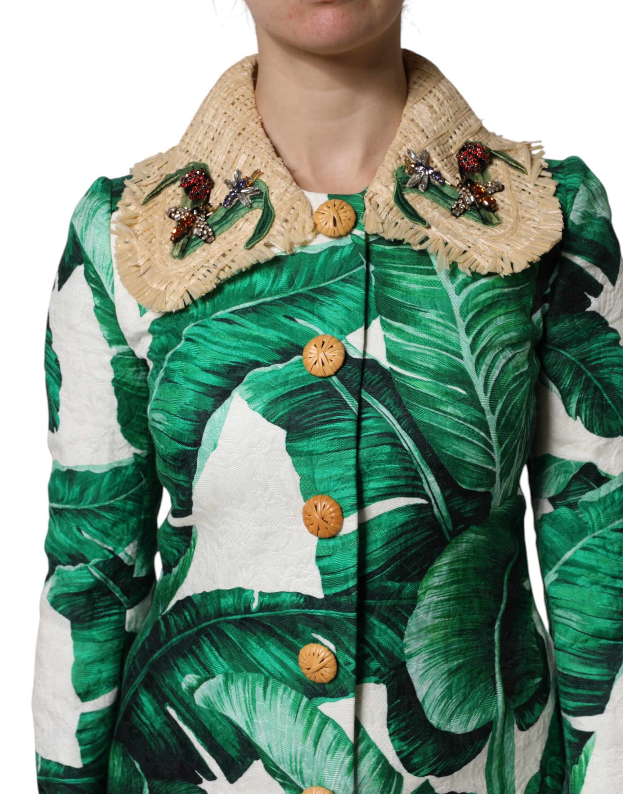 Experience the exquisite Dolce & Gabbana Multicolor Leaf Print Embellished Trenchcoat Jacket, a luxurious blend of silk and cotton, embodying timeless elegance and Italian craftsmanship for the discerning individual.