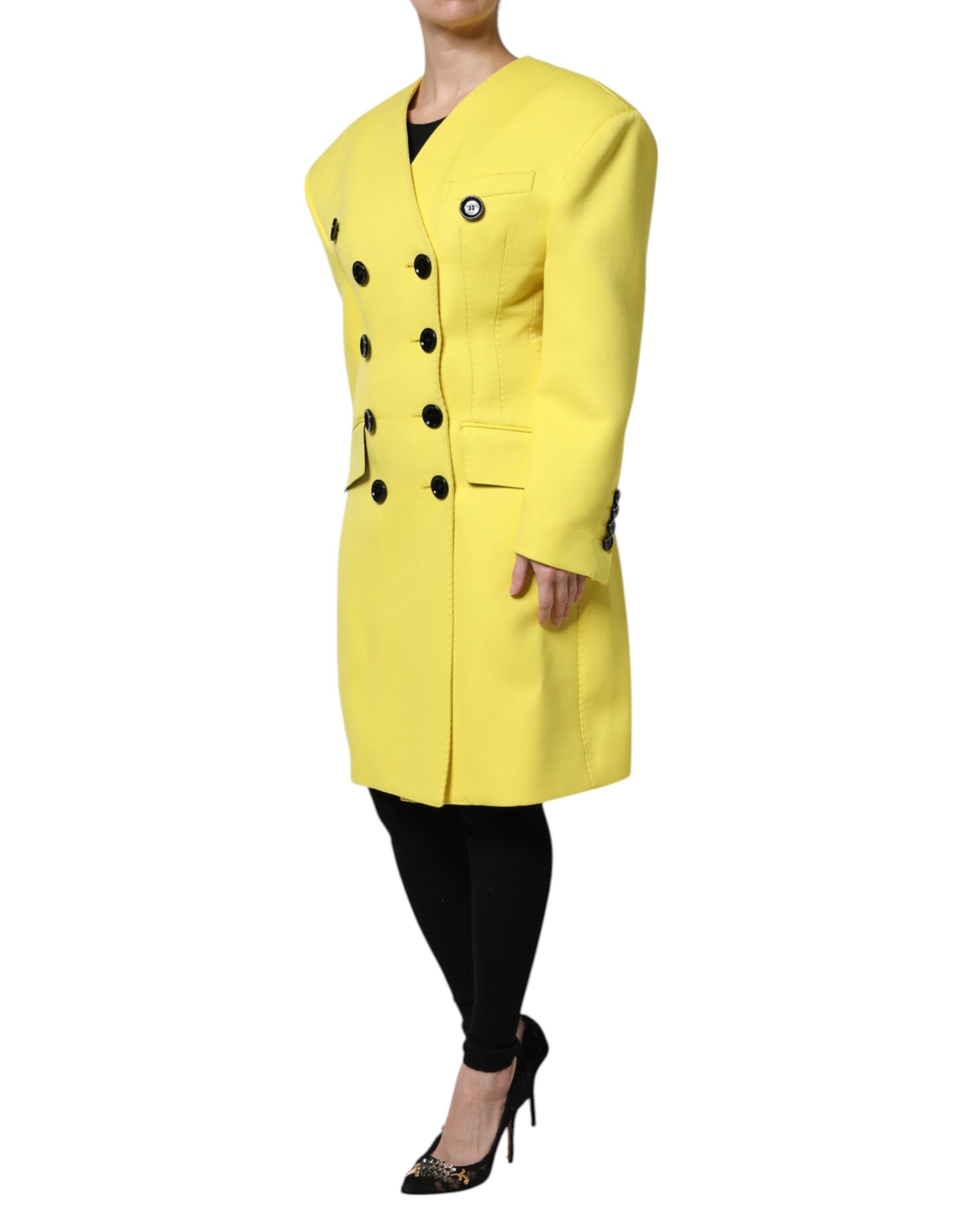 Indulge in the exquisite Dolce & Gabbana Yellow Double Breasted Trench Coat, crafted from 100% virgin wool, embodying timeless elegance and unparalleled luxury for the discerning individual.
