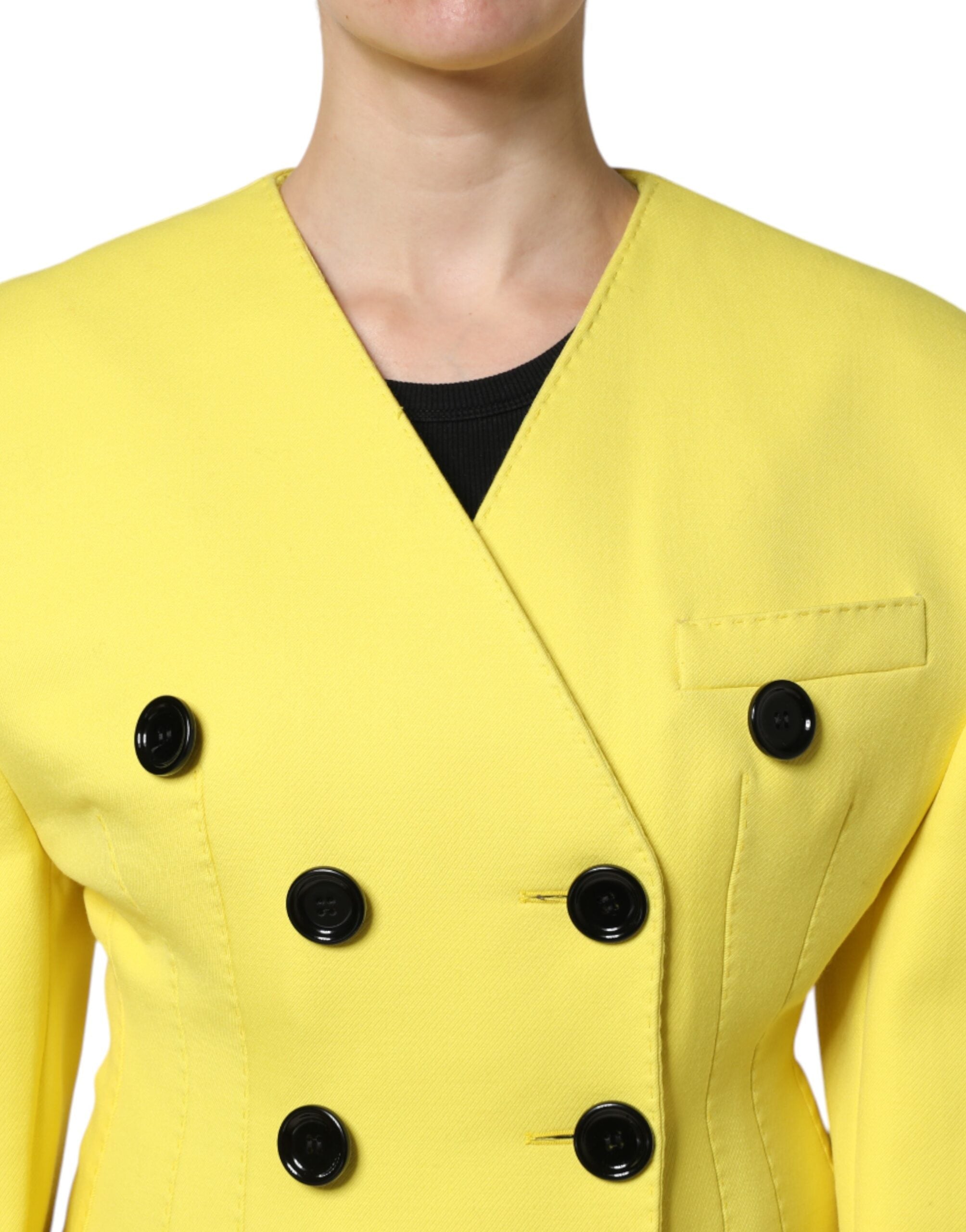 Elevate your wardrobe with the Dolce & Gabbana Yellow Double Breasted Trench Coat, a masterpiece of 100% virgin wool, embodying timeless elegance and exquisite Italian craftsmanship.