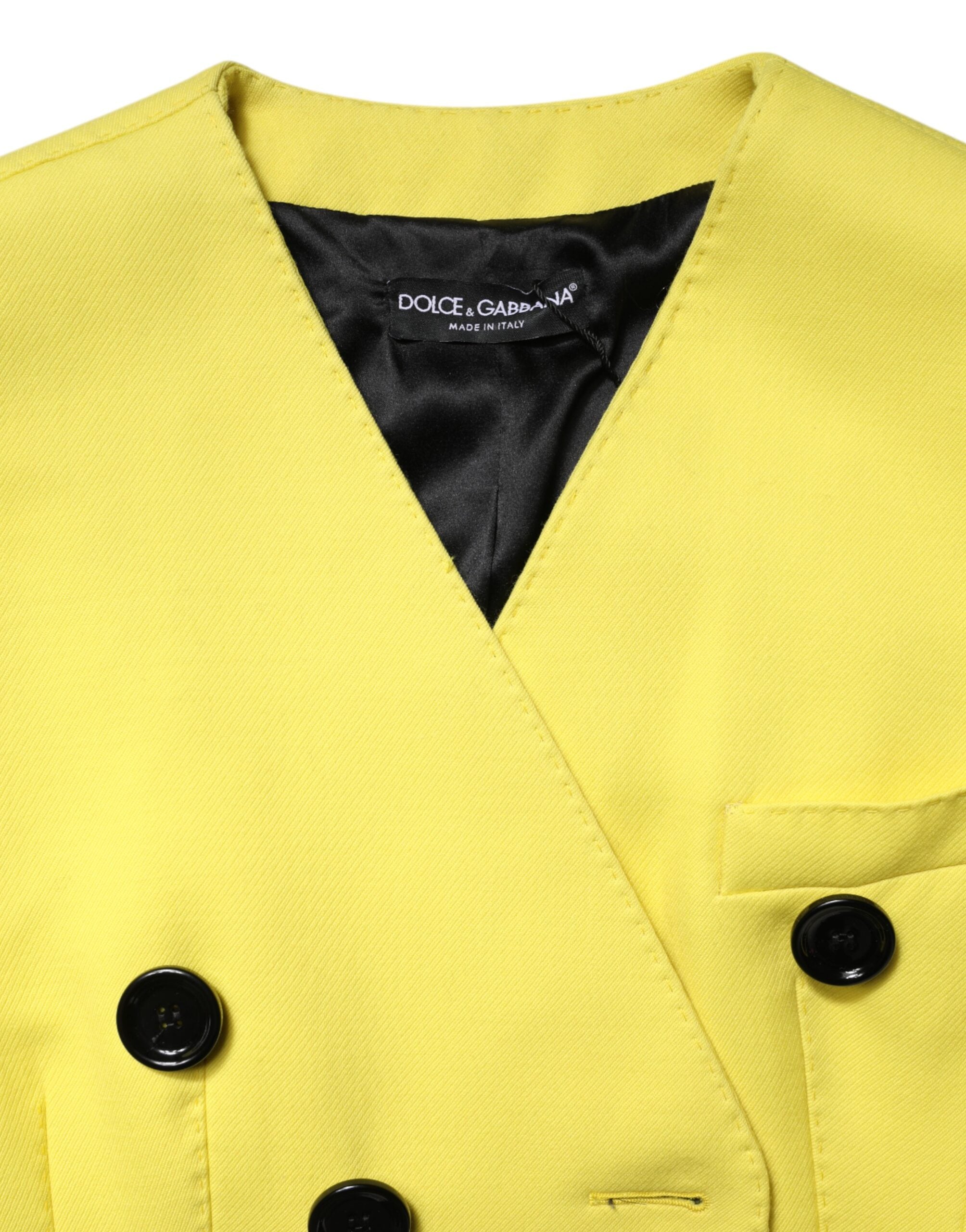Indulge in the exquisite Dolce & Gabbana Yellow Double Breasted Trench Coat, crafted from sumptuous virgin wool, embodying timeless elegance and unparalleled luxury.