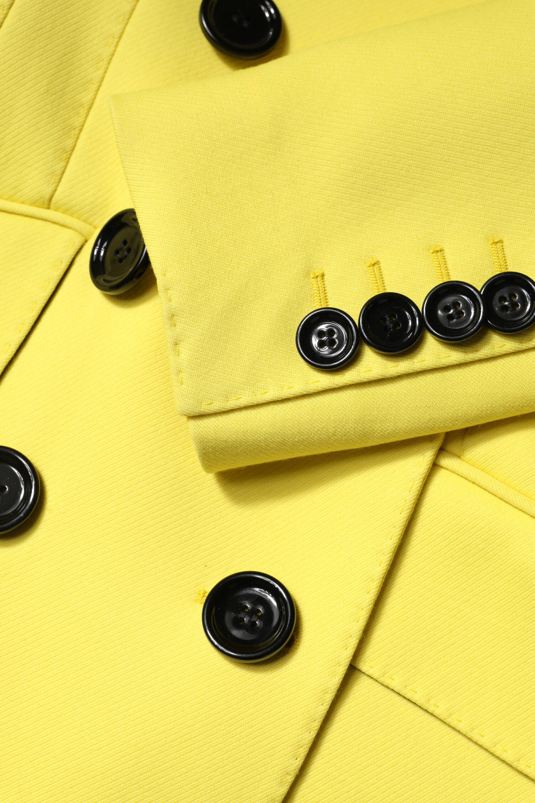 Indulge in the exquisite Dolce & Gabbana Yellow Double Breasted Trench Coat, a masterpiece of 100% virgin wool that redefines luxury and elegance for the discerning individual.