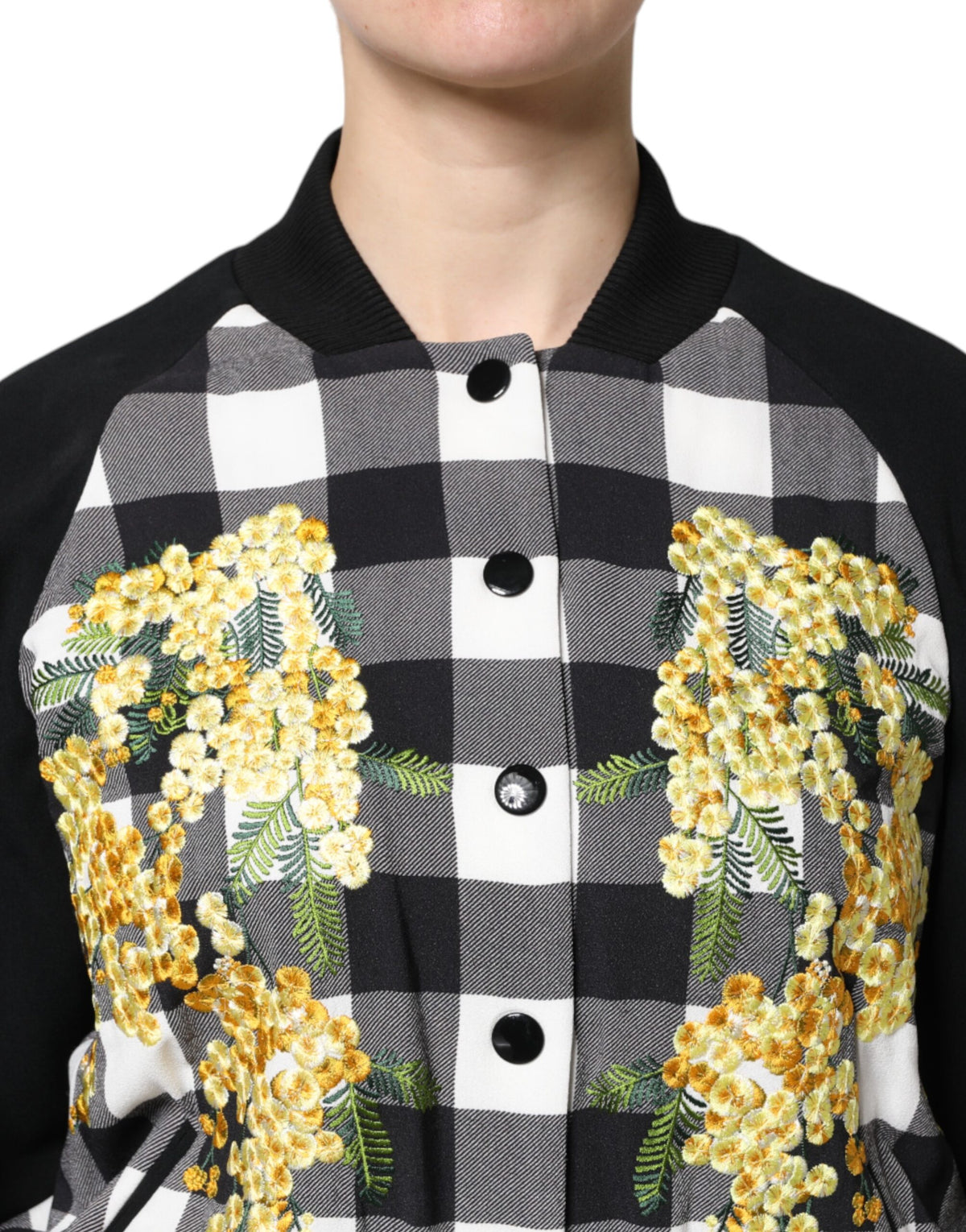 Elevate your wardrobe with the Dolce & Gabbana Black White Check Floral Button Down Jacket, a masterpiece of Italian craftsmanship that embodies timeless elegance and sophistication.