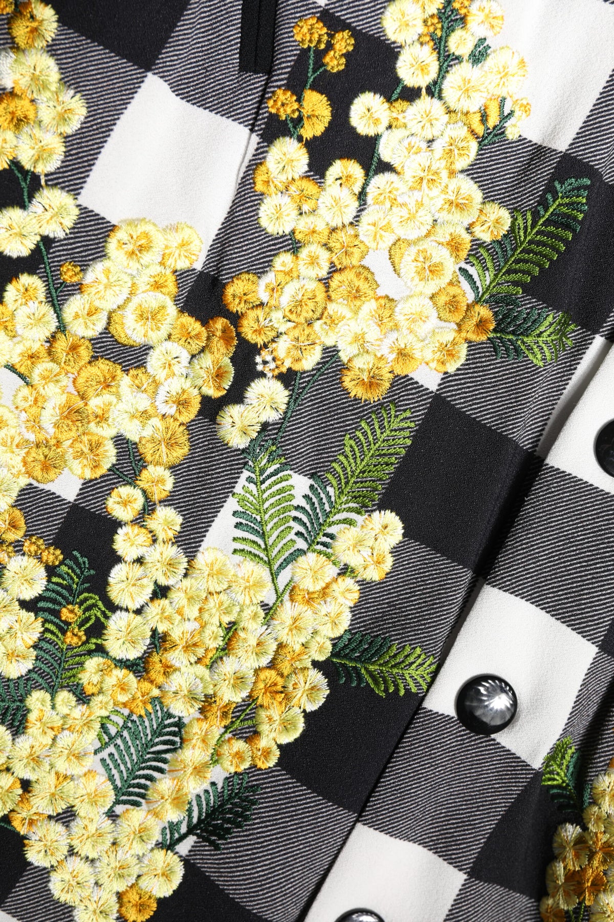 Elevate your wardrobe with the Dolce & Gabbana Black White Check Floral Button Down Jacket, a masterpiece of luxurious craftsmanship and timeless elegance, perfect for the discerning individual.
