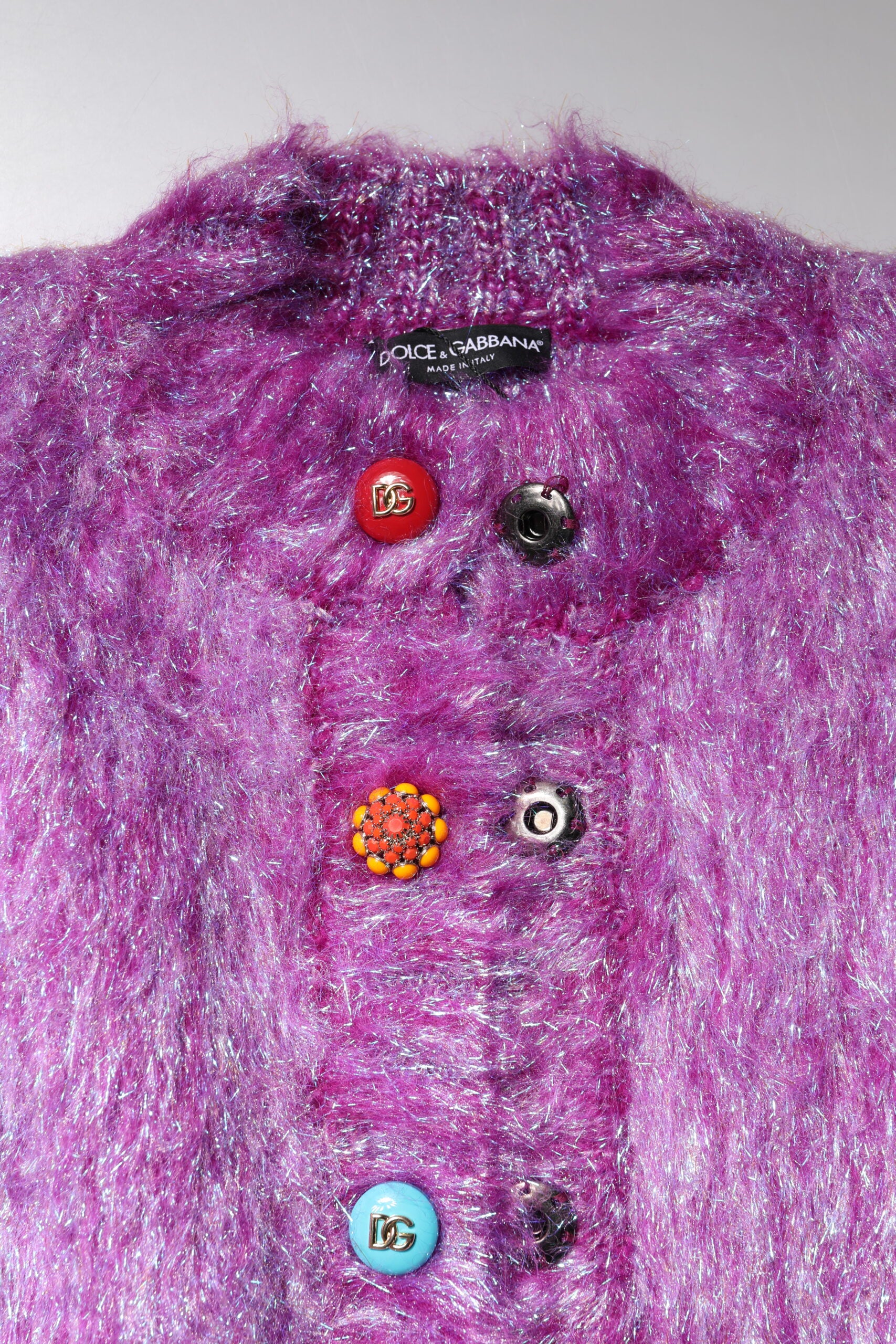 Experience the exquisite Dolce & Gabbana Purple Button Embellished Trench Coat, a luxurious blend of wool and mohair, embodying timeless elegance and refined sophistication.