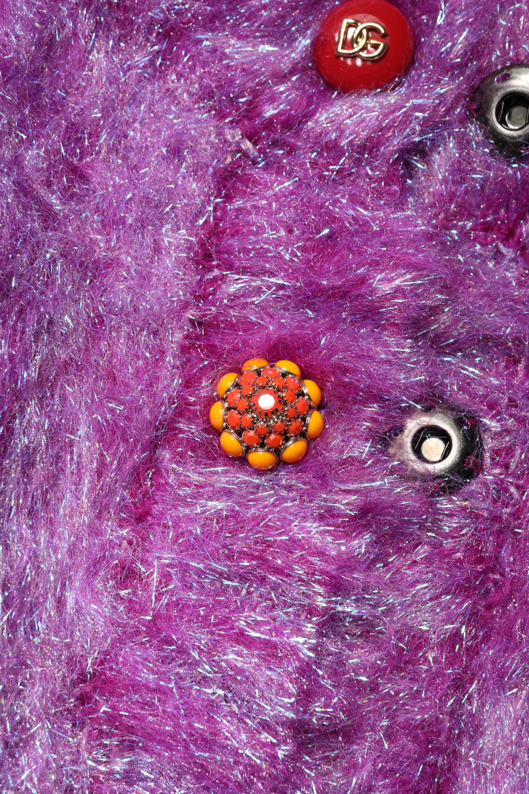 Experience the exquisite allure of the Dolce & Gabbana Purple Button Embellished Trench Coat, a luxurious blend of wool and mohair, crafted for timeless elegance and sophistication.