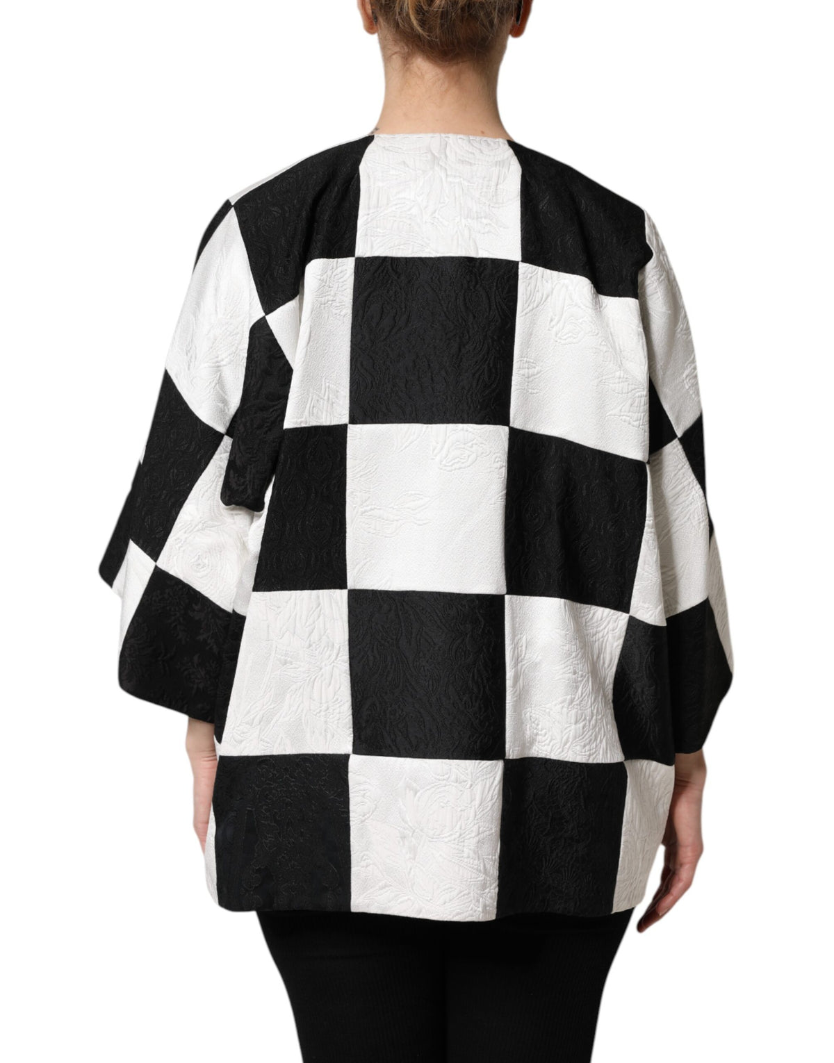 Elevate your style with the Dolce & Gabbana White Black Patchwork Jacquard Blazer, a testament to Italian craftsmanship and timeless elegance, perfect for any occasion.