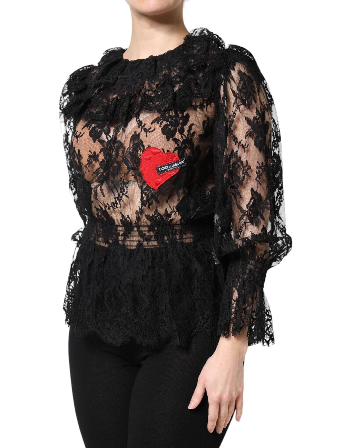 Indulge in the exquisite Dolce & Gabbana Black Cotton Floral Lace Blouse, where Italian craftsmanship meets timeless elegance, perfect for elevating any sophisticated wardrobe.