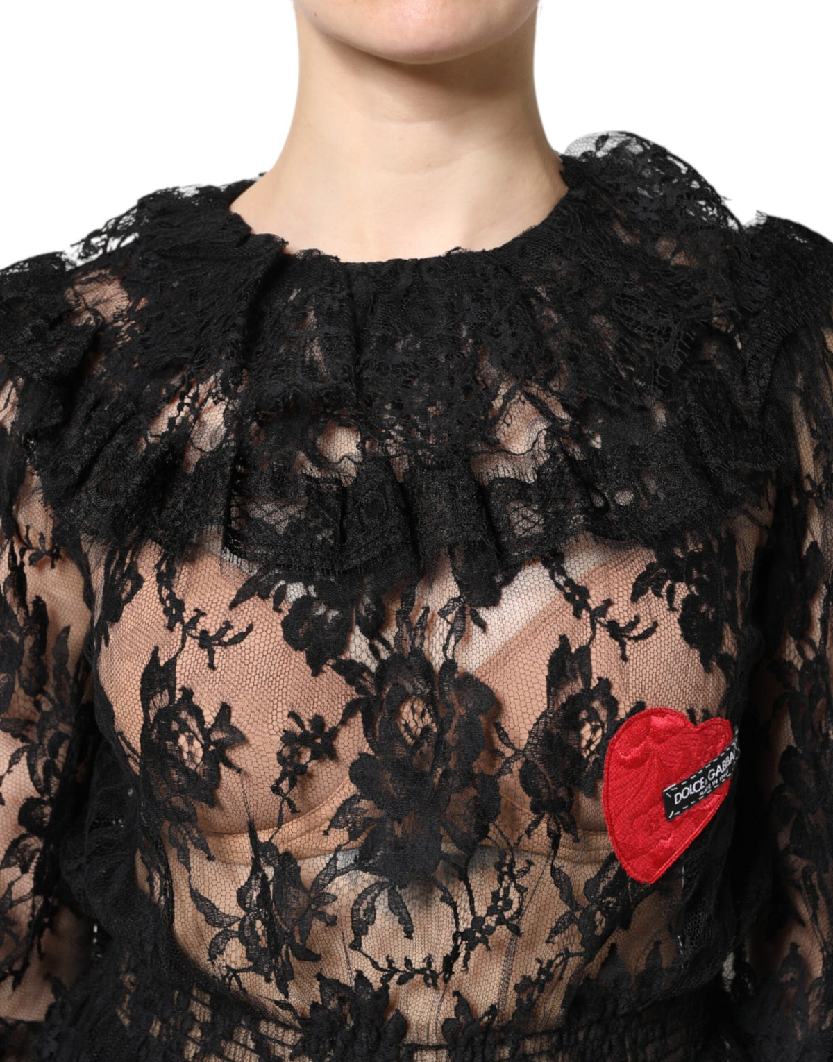 Indulge in the exquisite Dolce & Gabbana Black Cotton Floral Lace Blouse, where Italian craftsmanship meets modern elegance, elevating your wardrobe with timeless sophistication.