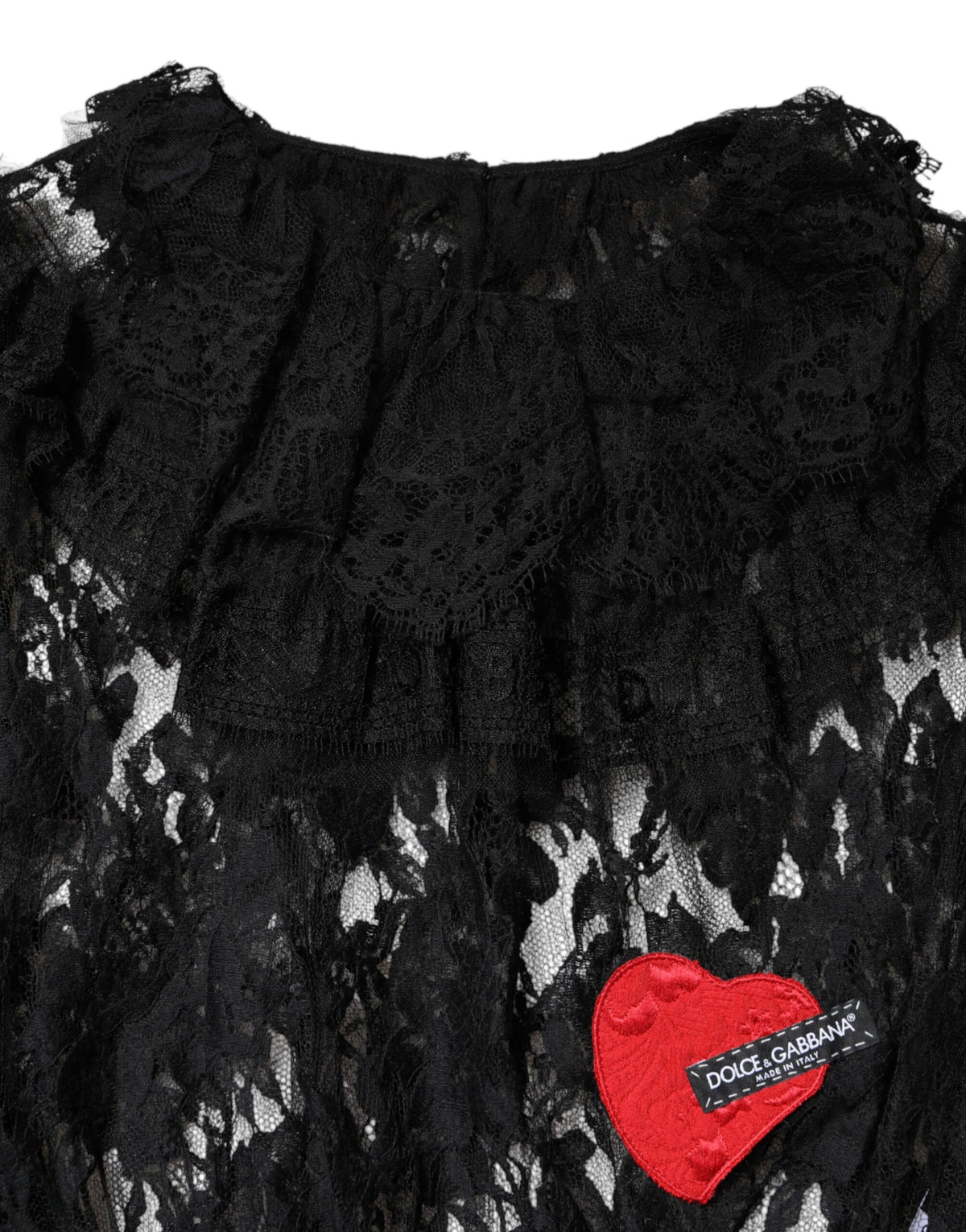 Indulge in the exquisite Dolce & Gabbana Black Cotton Floral Lace Blouse, a symbol of Italian craftsmanship that elevates elegance and allure for any sophisticated occasion.