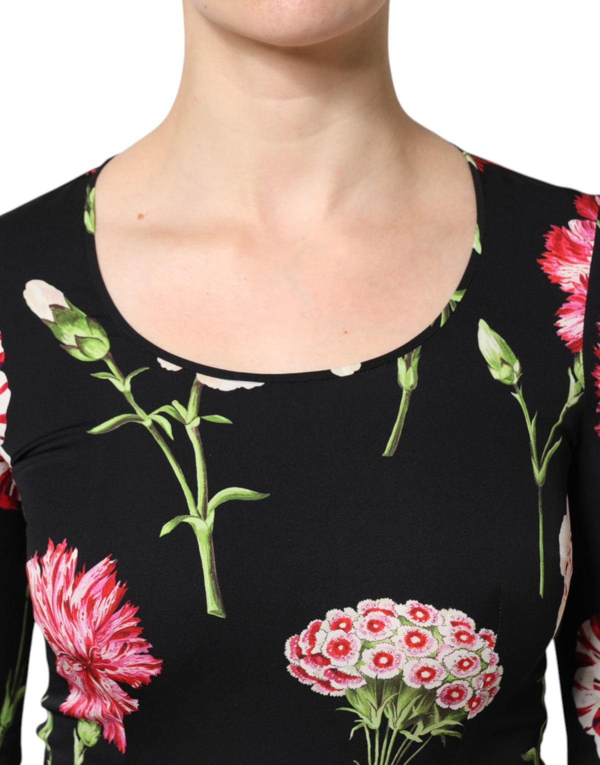 Elevate your elegance with the Dolce & Gabbana Black Floral Long Sleeve Blouse, a luxurious blend of silk and elastane, embodying exquisite Italian craftsmanship for the discerning individual.