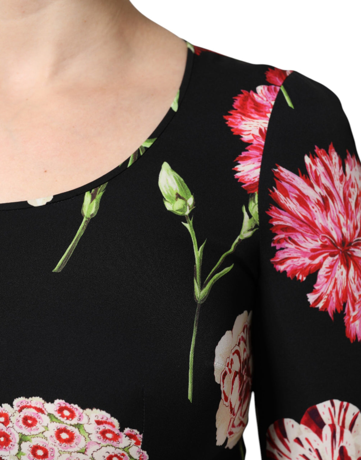 Elevate your elegance with the Dolce & Gabbana Black Floral Long Sleeve Blouse, a luxurious blend of silk and elastane, embodying exquisite Italian craftsmanship for the discerning individual.