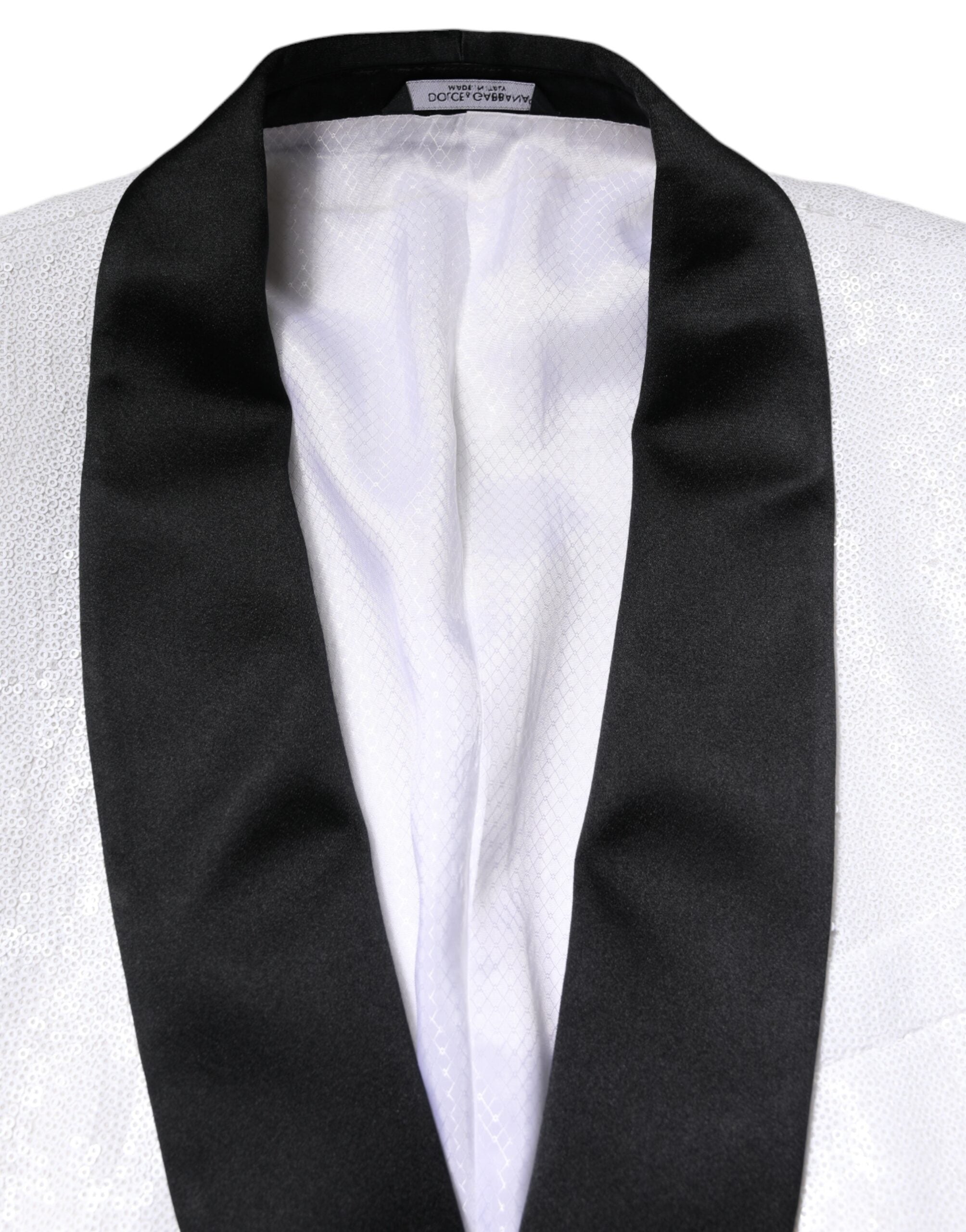 Discover the Dolce & Gabbana White Nylon Single Breasted Coat Blazer, a masterpiece of exquisite craftsmanship and luxurious silk lining, perfect for the discerning individual.