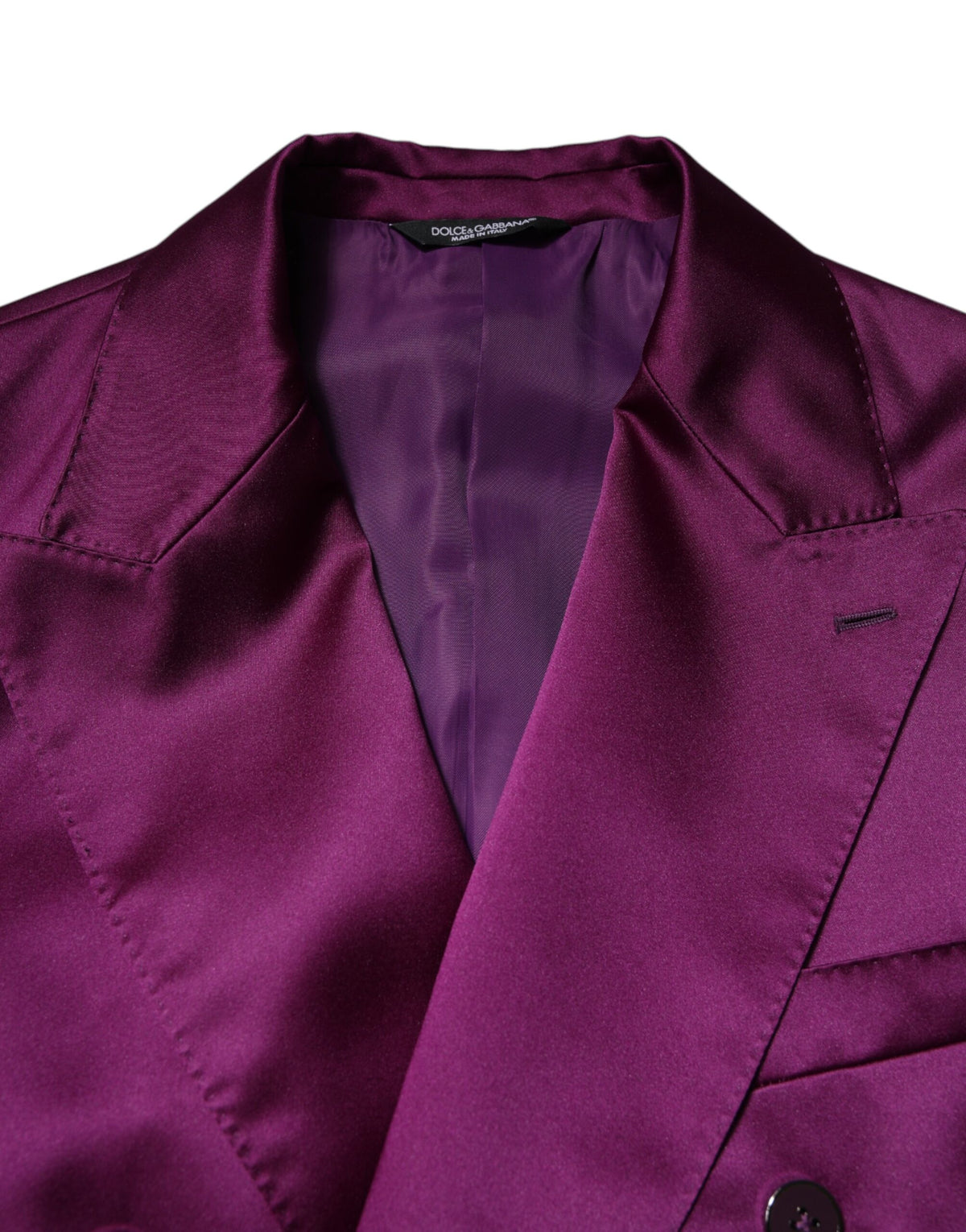Elevate your wardrobe with the Dolce & Gabbana Purple Double Breasted Men Suit Coat Blazer, a masterpiece of luxurious craftsmanship and timeless elegance, perfect for sophisticated occasions.