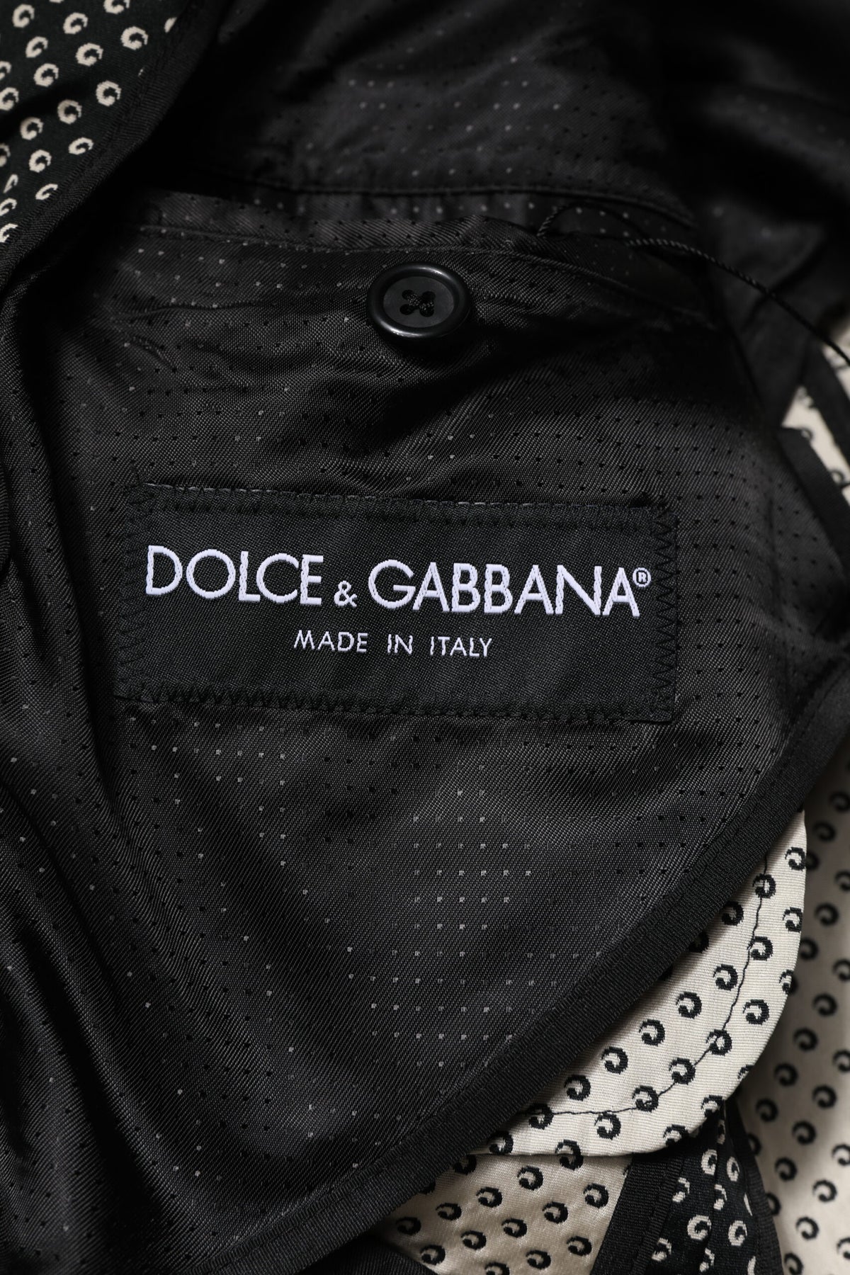 Indulge in the exquisite Dolce & Gabbana Black White Patterned Blazer, where timeless elegance meets unparalleled craftsmanship, perfect for the discerning individual.