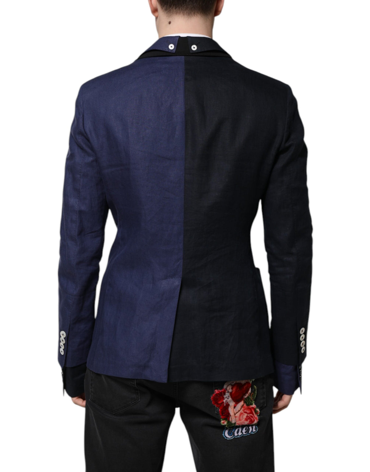 Elevate your wardrobe with the Dolce & Gabbana Navy Blue Double Breasted Suit Coat Blazer, a masterpiece of luxury tailoring crafted from a sumptuous blend of flax and virgin wool, embodying timeless elegance and sophistication.