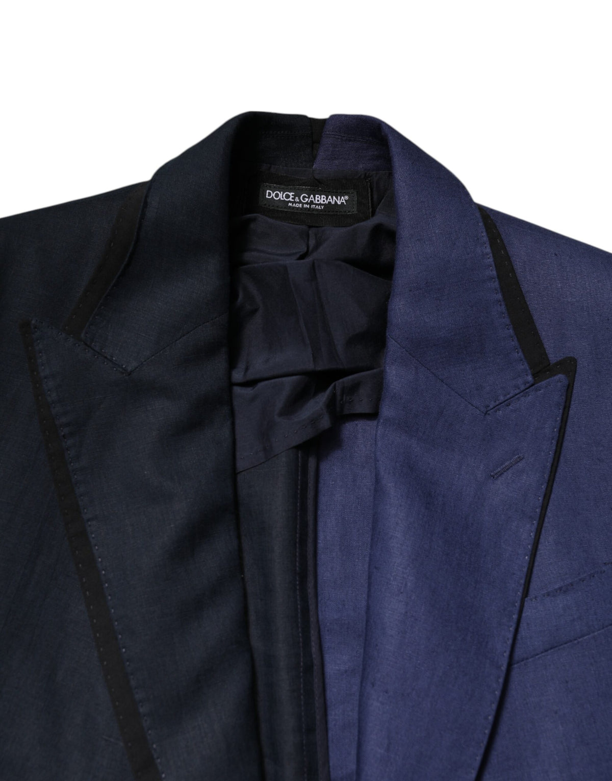 Elevate your wardrobe with the Dolce & Gabbana Navy Blue Double Breasted Suit Coat Blazer, a masterpiece of Italian craftsmanship in luxurious flax and virgin wool.