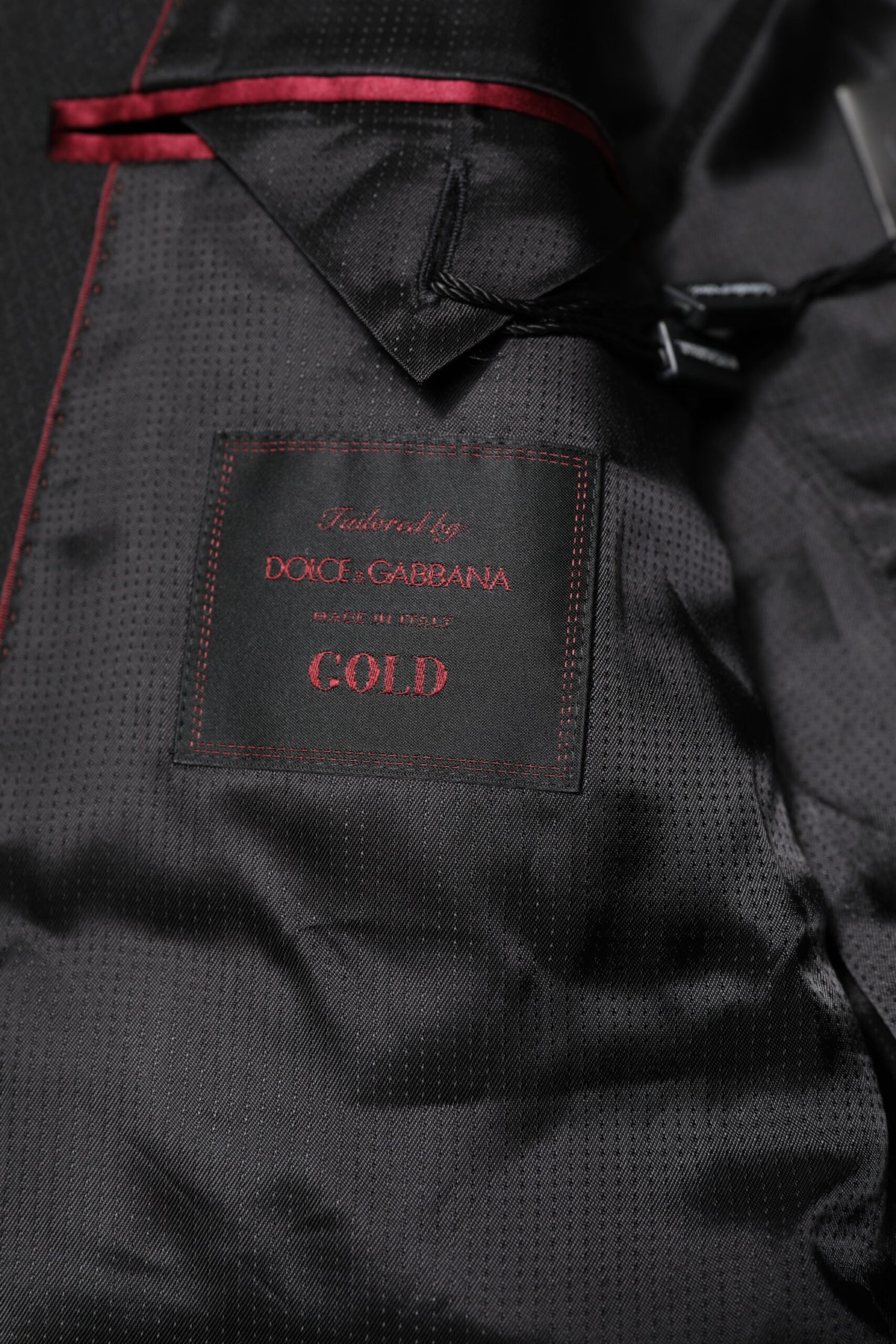 Indulge in the exquisite Dolce & Gabbana Black GOLD Single Breasted Suit Coat Blazer, crafted from 100% virgin wool, embodying timeless elegance and unparalleled sophistication for the discerning individual.