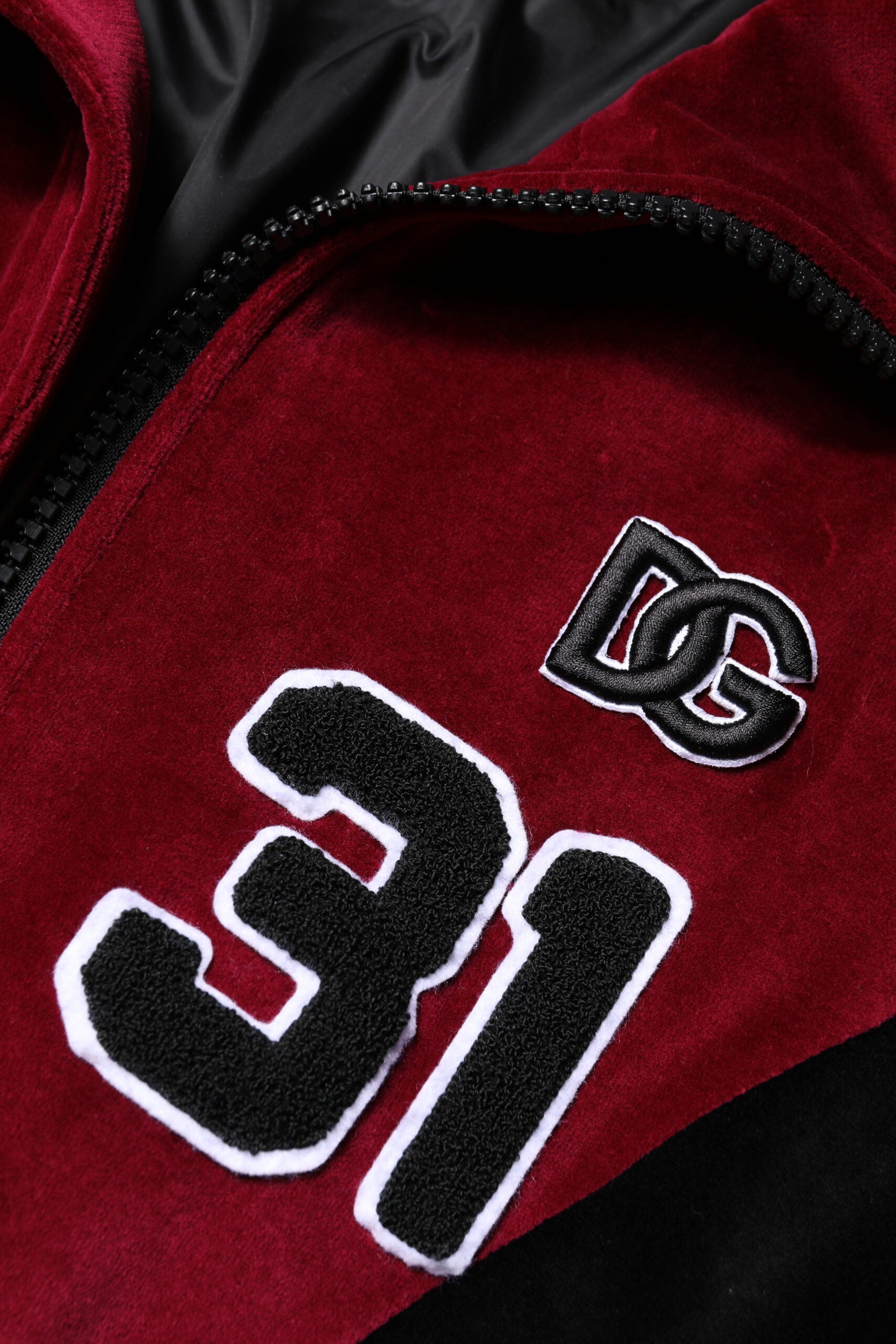 Indulge in the Dolce & Gabbana Red Black Cotton Logo FullZip Bomber Jacket, where Italian craftsmanship meets luxurious comfort, elevating your style narrative effortlessly.