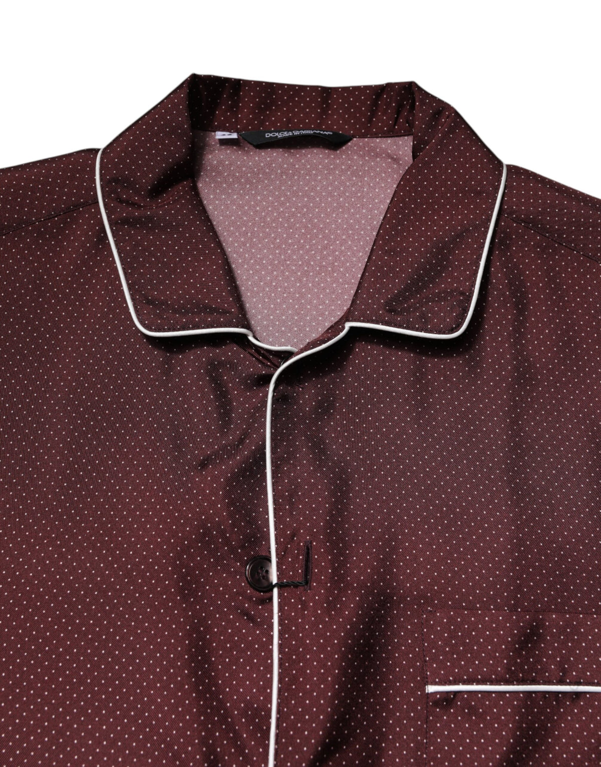Experience the allure of the Dolce & Gabbana Burgundy Silk Dotted Long Sleeves Shirt, a testament to Italian craftsmanship that elevates your elegance and sophistication.