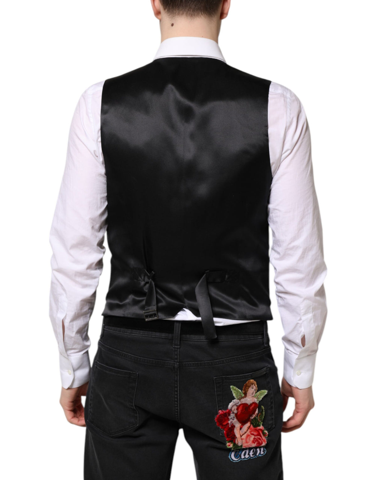 Discover the Dolce & Gabbana Black Wool Waistcoat Dress Formal Vest, a masterpiece of exquisite craftsmanship and luxurious materials, perfect for the discerning fashion connoisseur.
