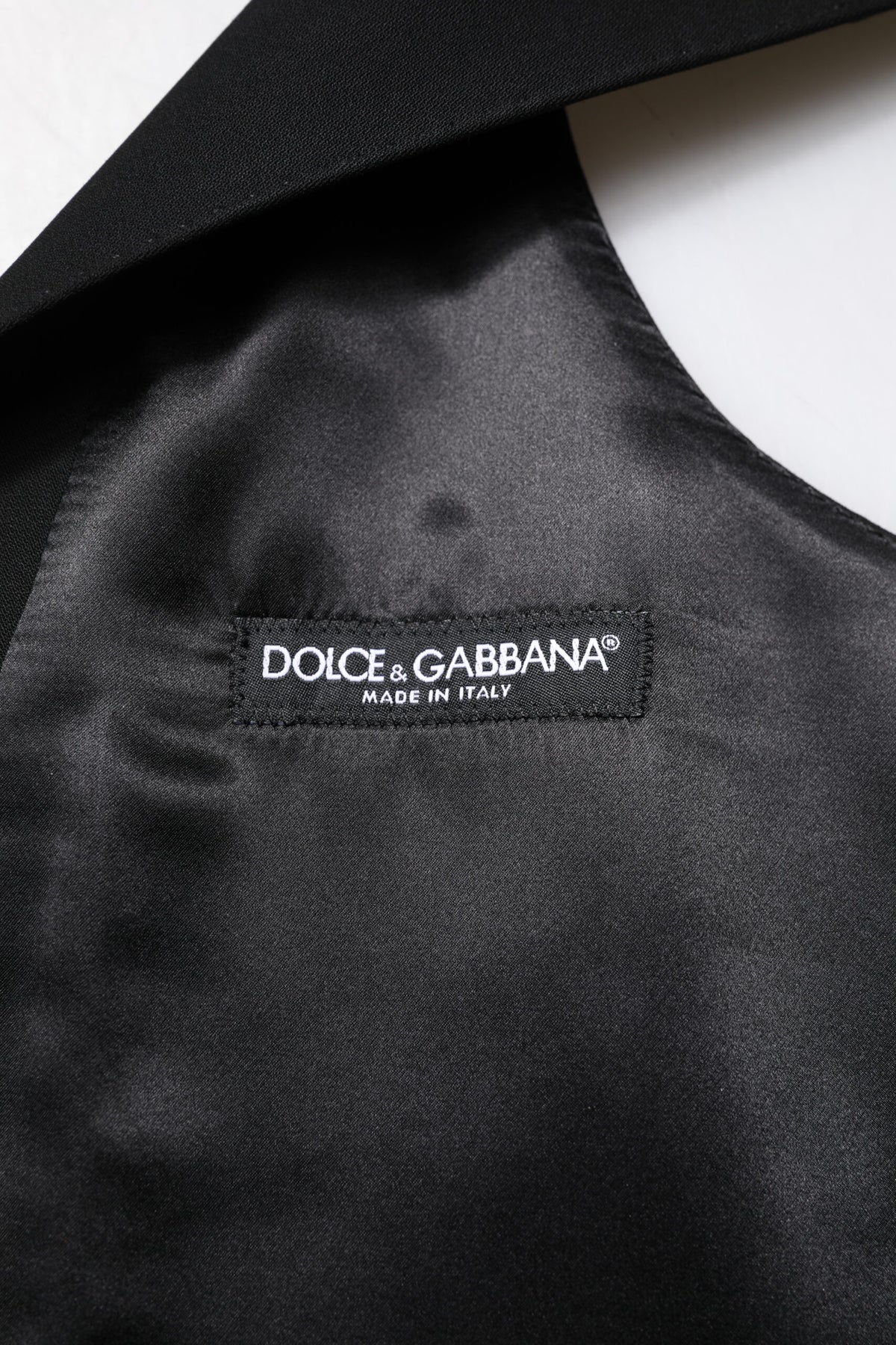 Discover the Dolce & Gabbana Black Wool Waistcoat Dress Formal Vest, a masterpiece of exquisite craftsmanship and luxurious materials, perfect for the discerning individual.