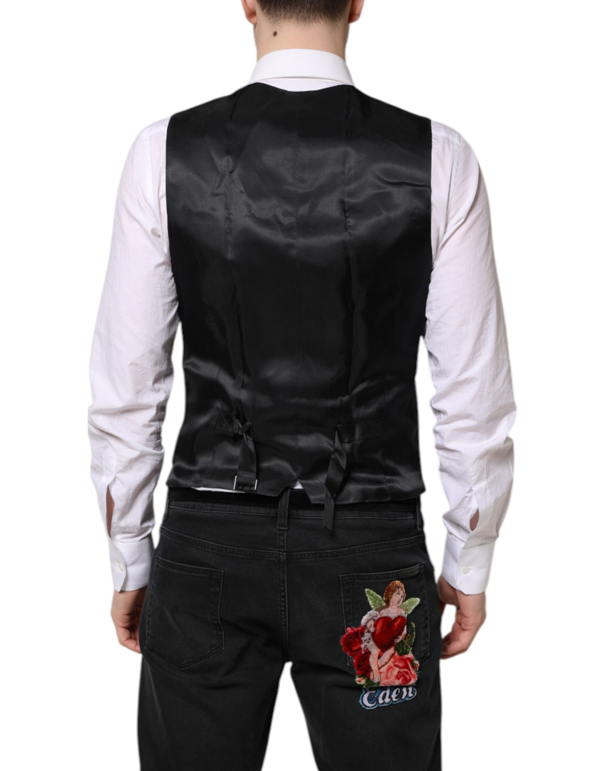 Elevate your wardrobe with the Dolce & Gabbana Black Wool Waistcoat Dress Formal Vest, a luxurious blend of virgin wool and silk, embodying timeless elegance and exquisite craftsmanship.