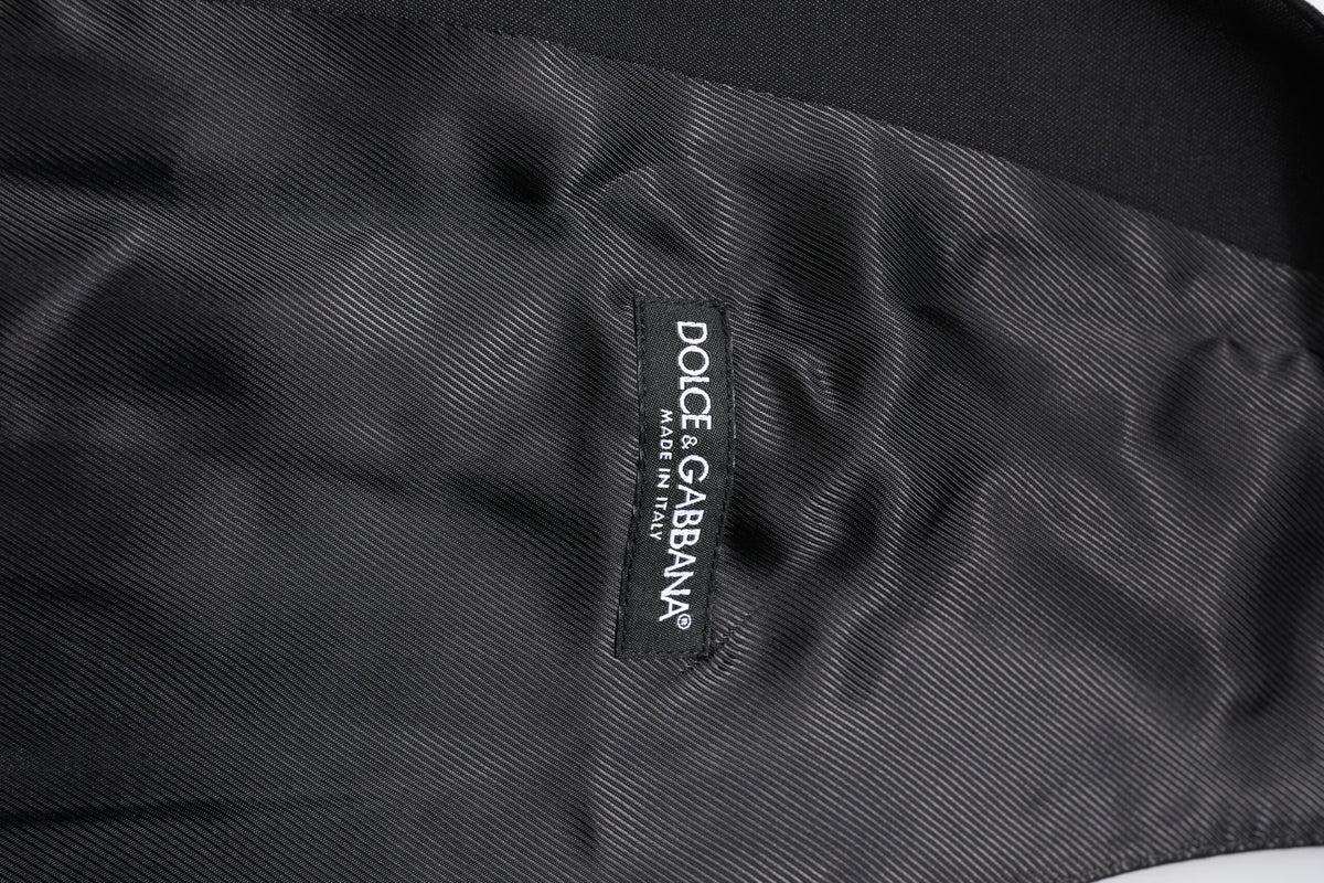 Indulge in the exquisite Dolce & Gabbana Black Wool Waistcoat Dress Formal Vest, a luxurious blend of virgin wool and silk, embodying timeless elegance and sophisticated allure.