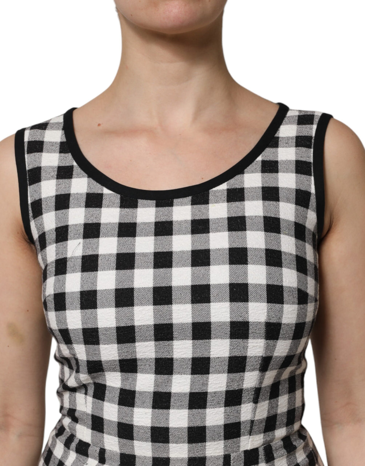 Indulge in the Dolce & Gabbana White Black Checkered Sleeveless Sheath Dress, a masterpiece of Italian craftsmanship that embodies timeless elegance and sophisticated allure.