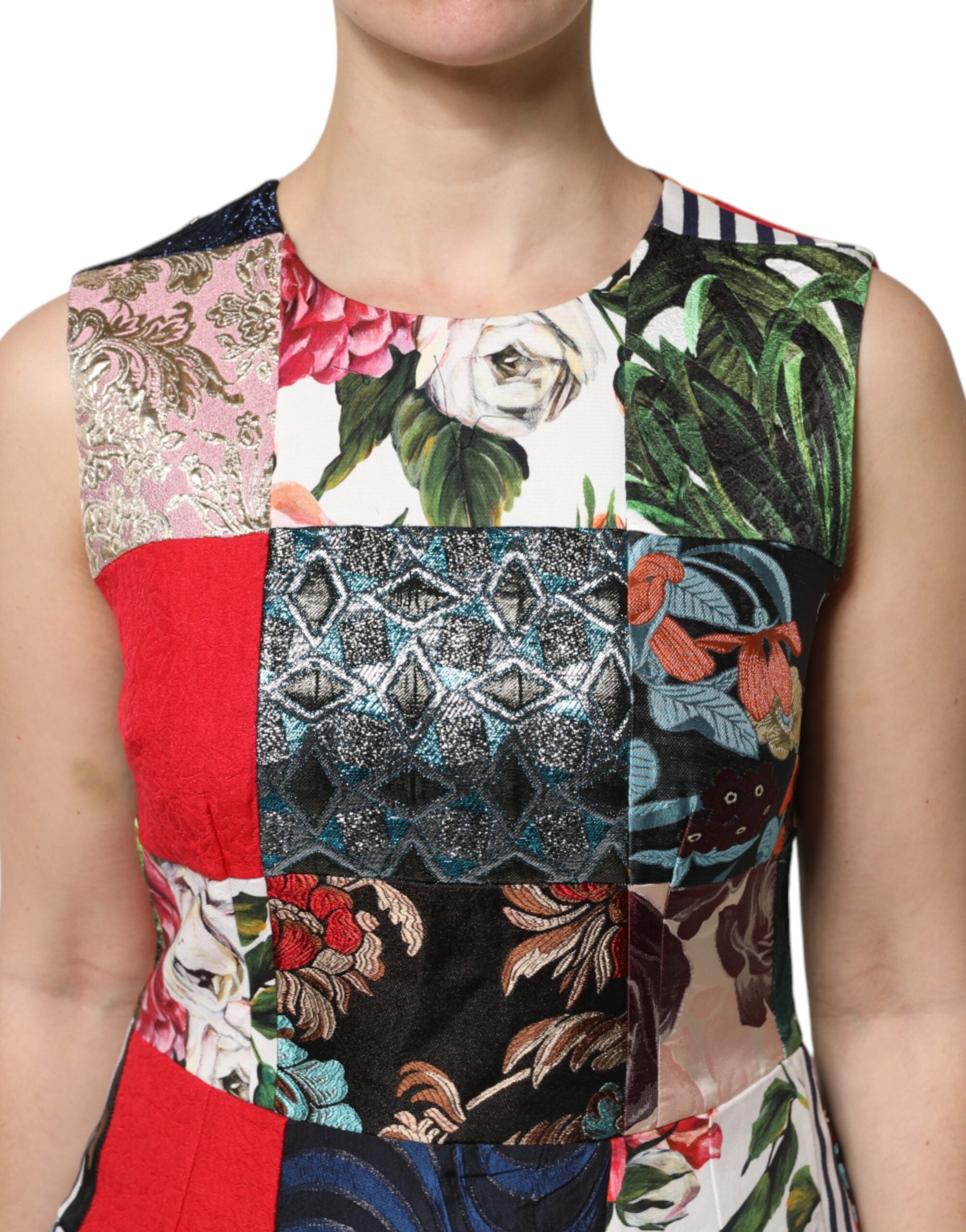 Indulge in the exquisite artistry of the Dolce & Gabbana Multicolor Patchwork Sleeveless Sheath Dress, crafted in Italy from luxurious materials for unparalleled elegance.