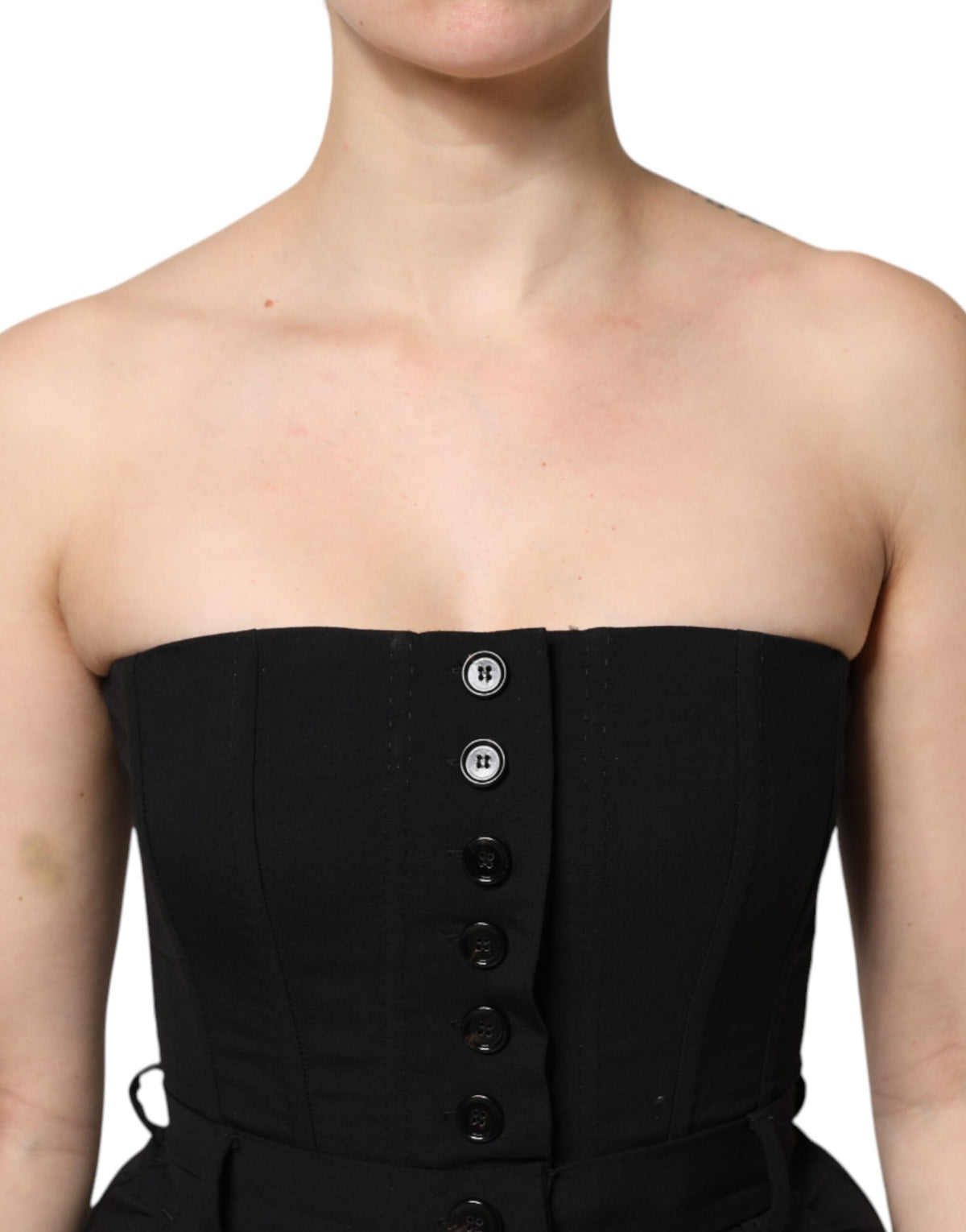 Indulge in the exquisite Dolce & Gabbana Black Wool Strapless Romper Jumpsuit Dress, a timeless masterpiece crafted from luxurious virgin wool and silk, embodying unparalleled elegance and sophistication.
