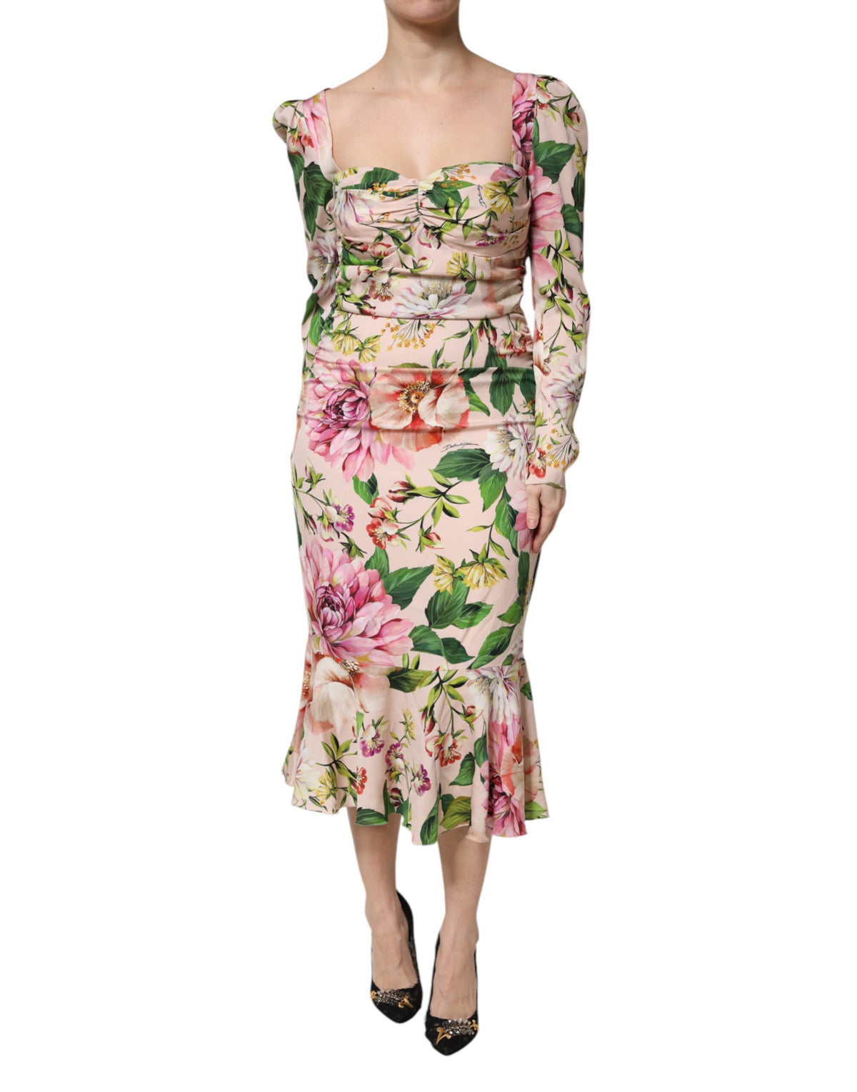 Experience the allure of the Dolce & Gabbana Pink Floral Silk Fit And Flared Midi Dress, where exquisite craftsmanship meets timeless elegance for the discerning individual.