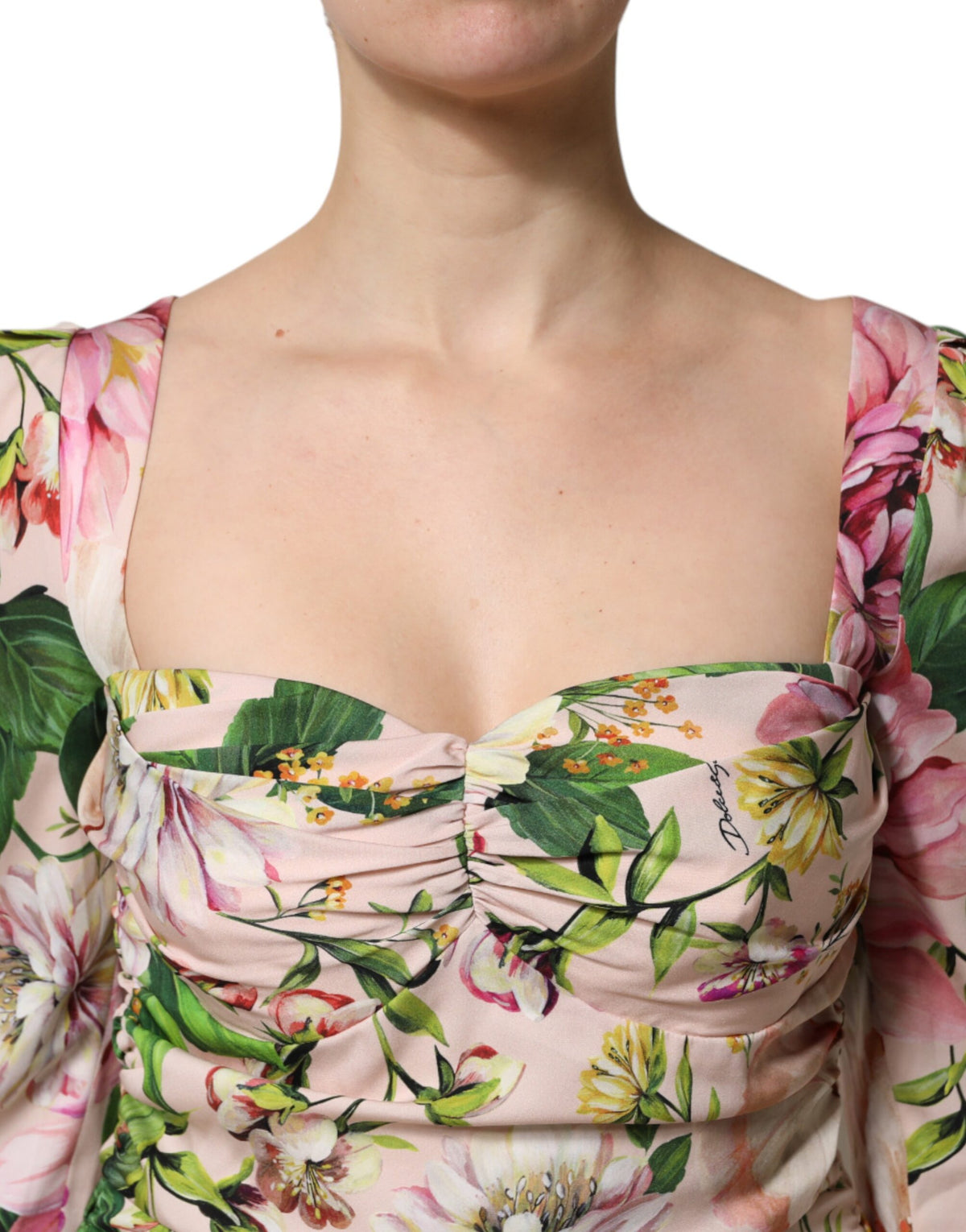 Experience the allure of the Dolce & Gabbana Pink Floral Silk Fit And Flared Midi Dress, a masterpiece of Italian craftsmanship that embodies timeless elegance and sophisticated femininity.