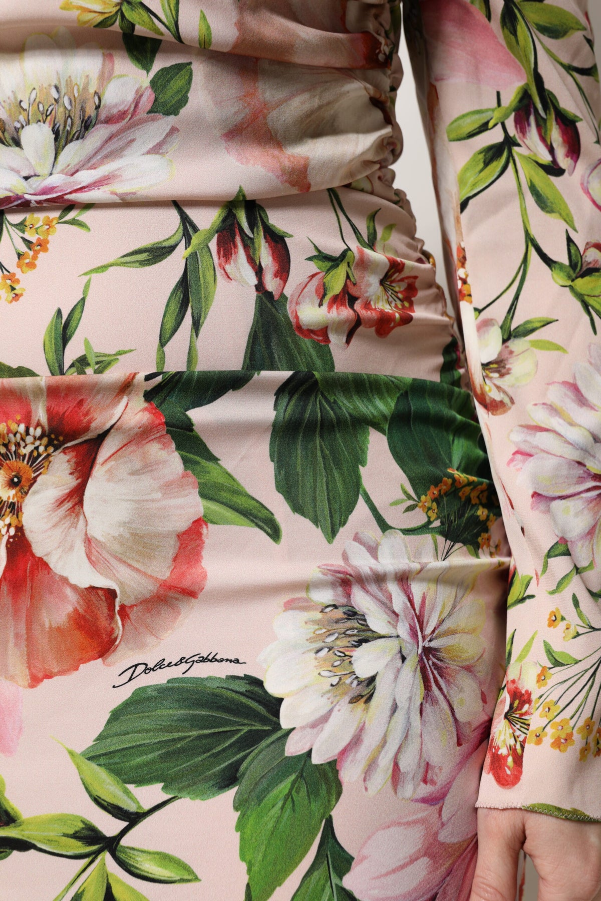 Experience the allure of Dolce & Gabbana's Pink Floral Silk Fit And Flared Midi Dress, a masterpiece of Italian craftsmanship that redefines elegance and sophistication.