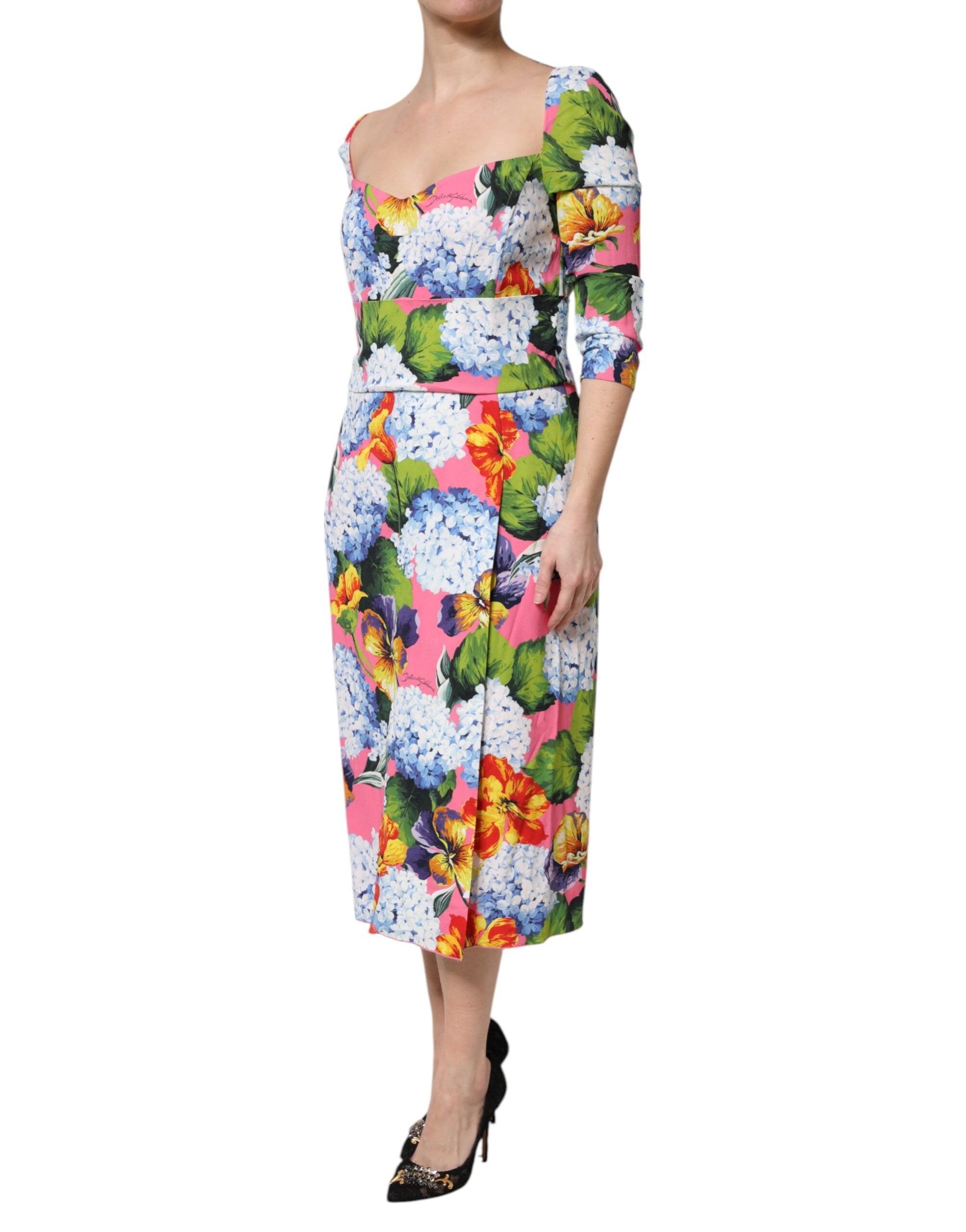 Discover the Dolce & Gabbana Multicolor Floral Pleated Sheath Midi Dress, a masterpiece of luxurious silk and viscose, embodying timeless elegance and exquisite craftsmanship for the discerning individual.