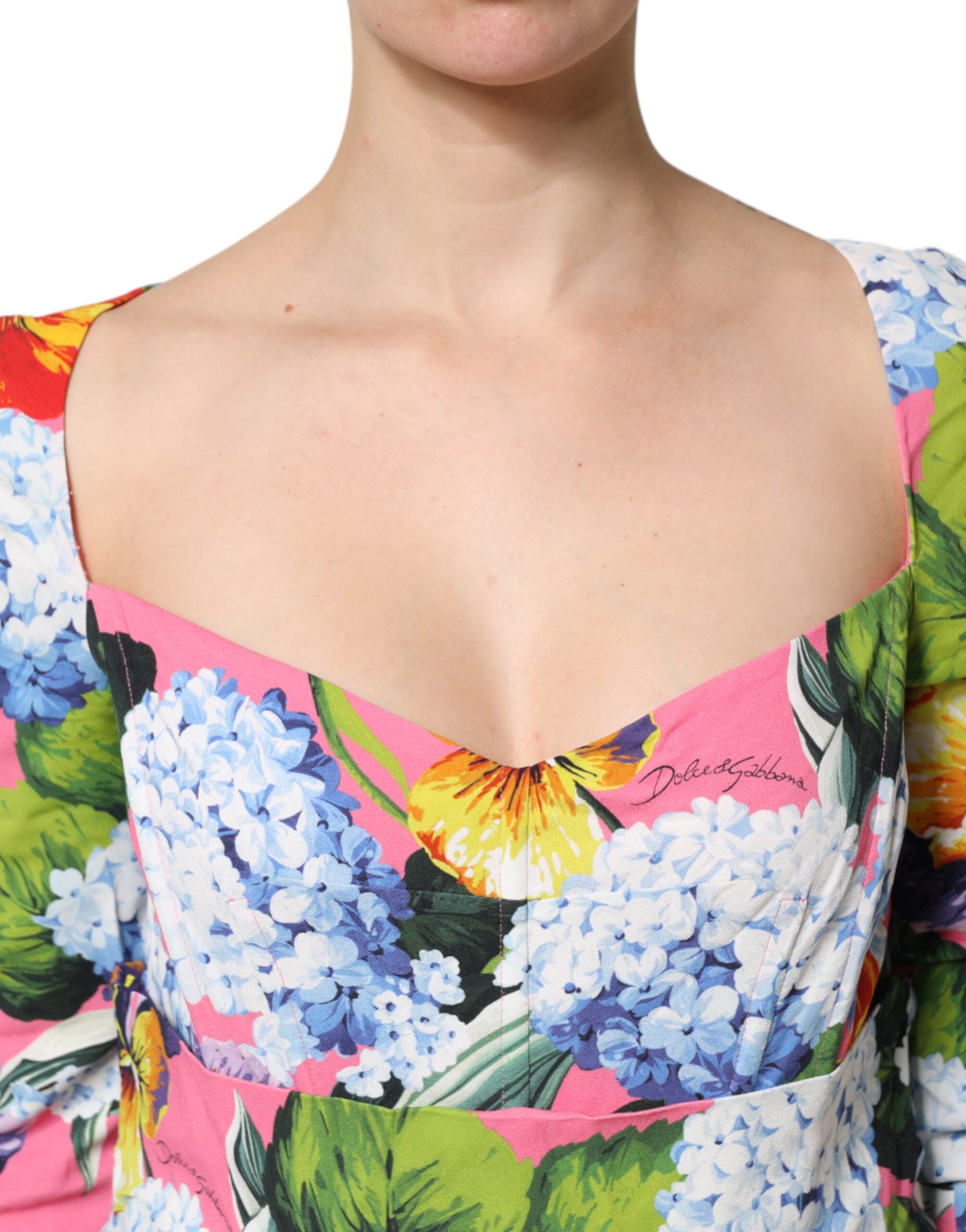 Indulge in the exquisite Dolce & Gabbana Multicolor Floral Pleated Sheath Midi Dress, a masterpiece of luxurious craftsmanship and vibrant artistry, perfect for any elegant occasion.