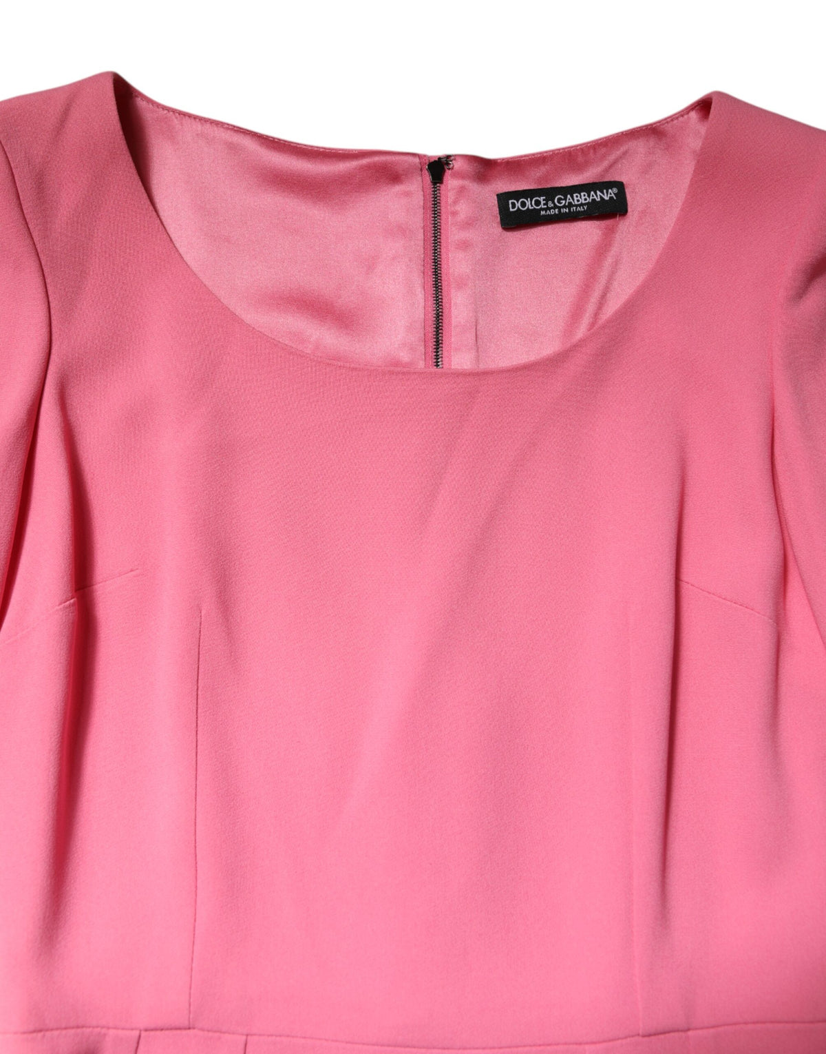 Experience the allure of the Dolce & Gabbana Pink Viscose Short Sleeve Sheath Midi Dress, a masterpiece of Italian craftsmanship that embodies timeless elegance and sensual sophistication.