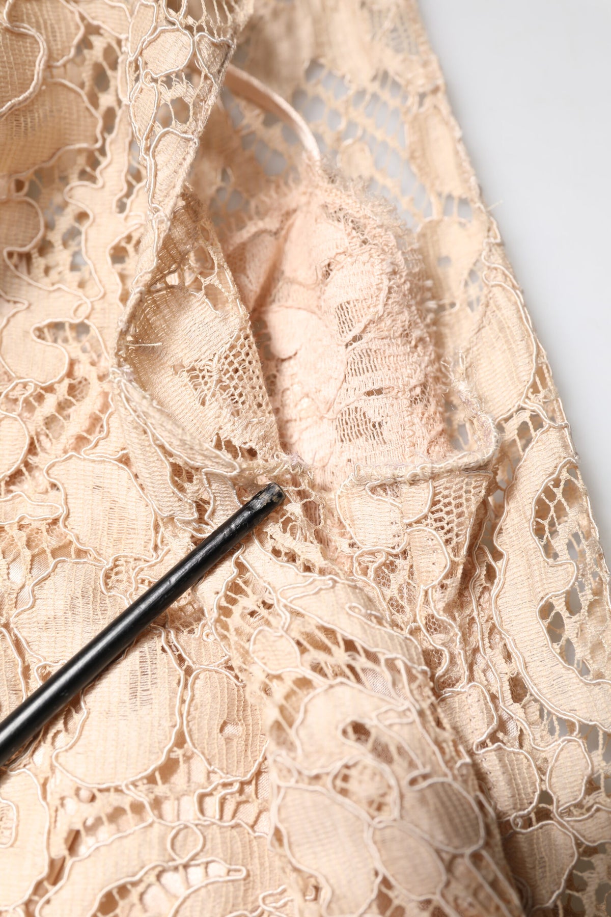 Discover the exquisite Dolce & Gabbana Beige Floral Lace Sleeveless Sheath Dress, a timeless masterpiece crafted in Italy, embodying elegance and sophistication for the discerning muse.