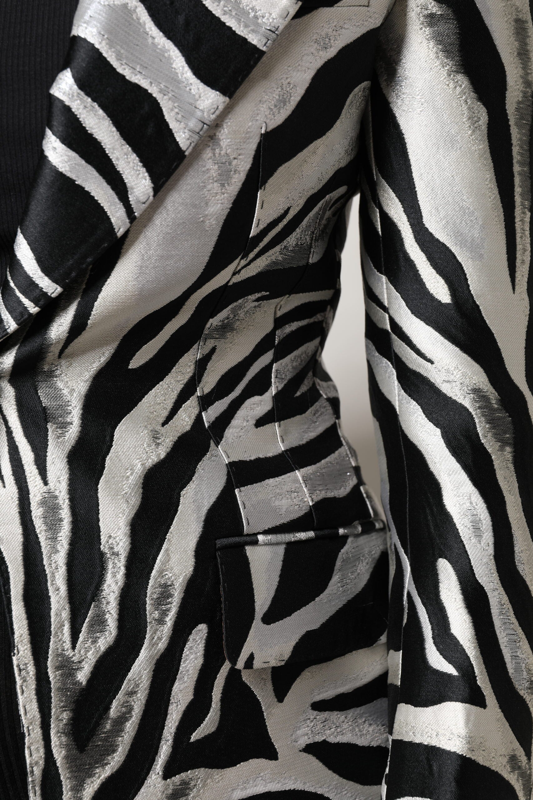 Indulge in the exquisite Dolce & Gabbana Black White Polyester Women Blazer Jacket, a luxurious statement piece crafted in Italy, embodying timeless elegance and bold sophistication.
