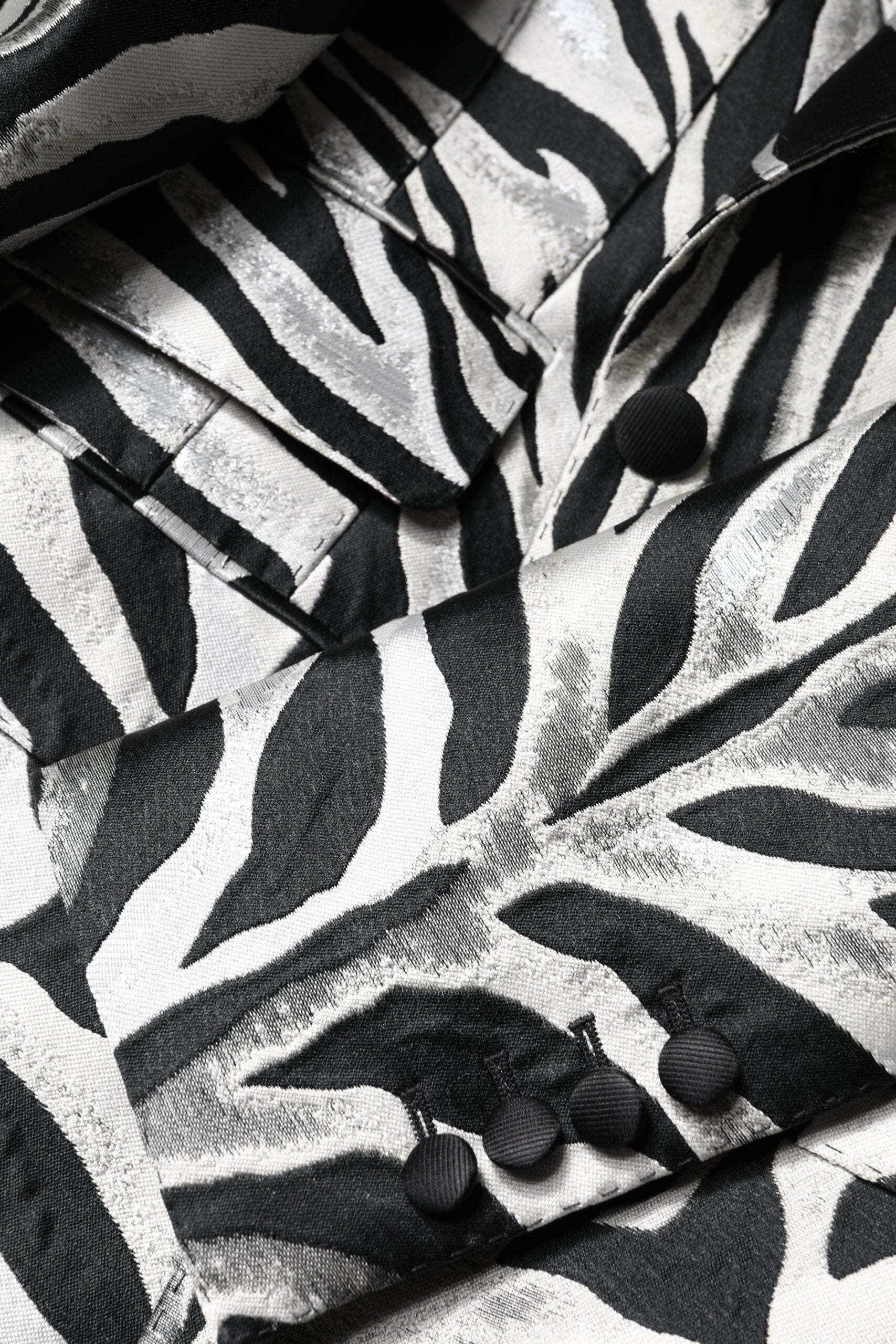 Elevate your wardrobe with the Dolce & Gabbana Black White Polyester Women Blazer Jacket, a masterpiece of Italian craftsmanship that embodies timeless elegance and bold sophistication.