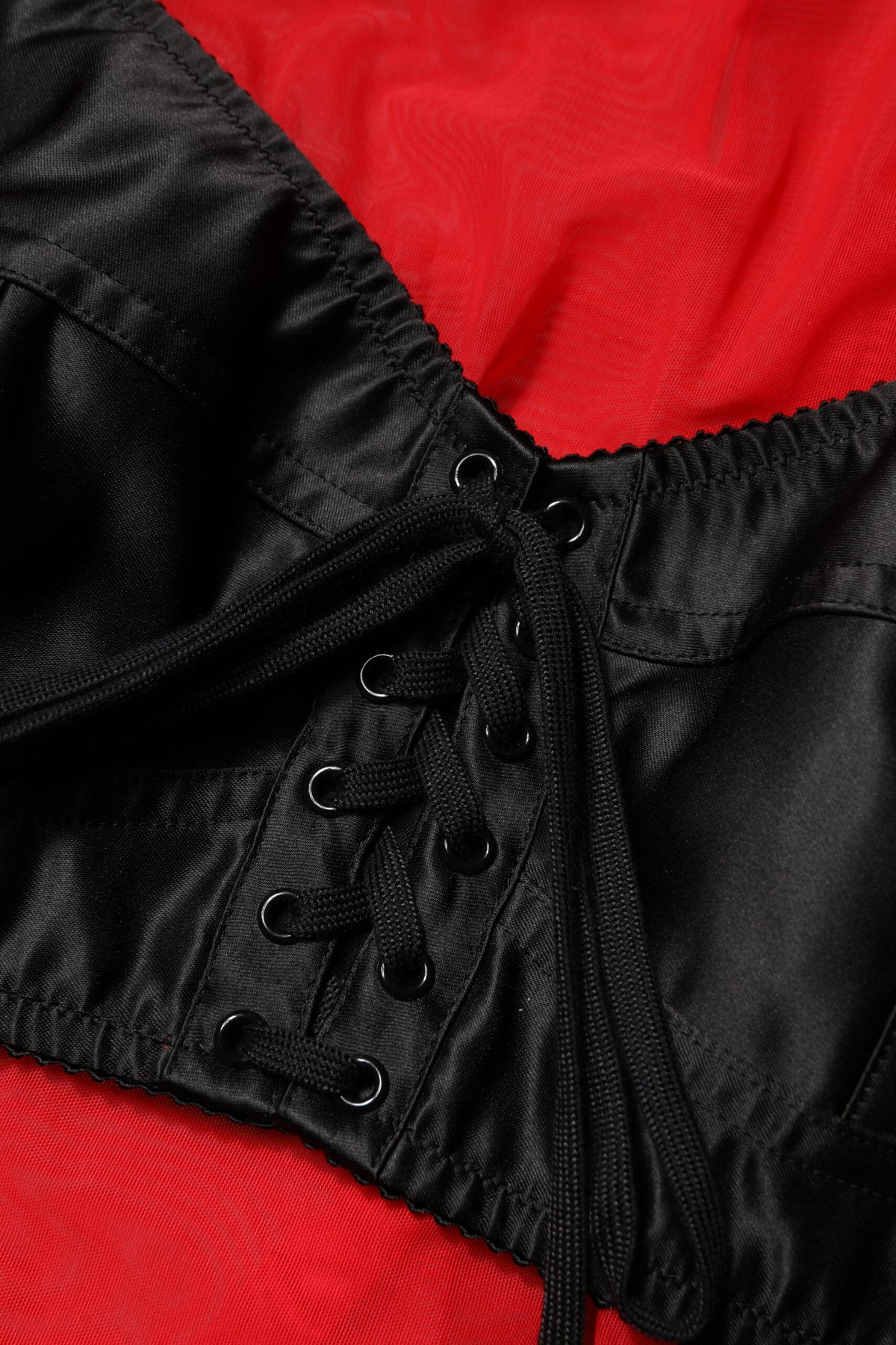 Elevate your style with the Dolce & Gabbana Red Black Bustier Long Sleeves Top, a masterpiece of Italian craftsmanship in luxurious nylon and elastane, embodying timeless elegance.