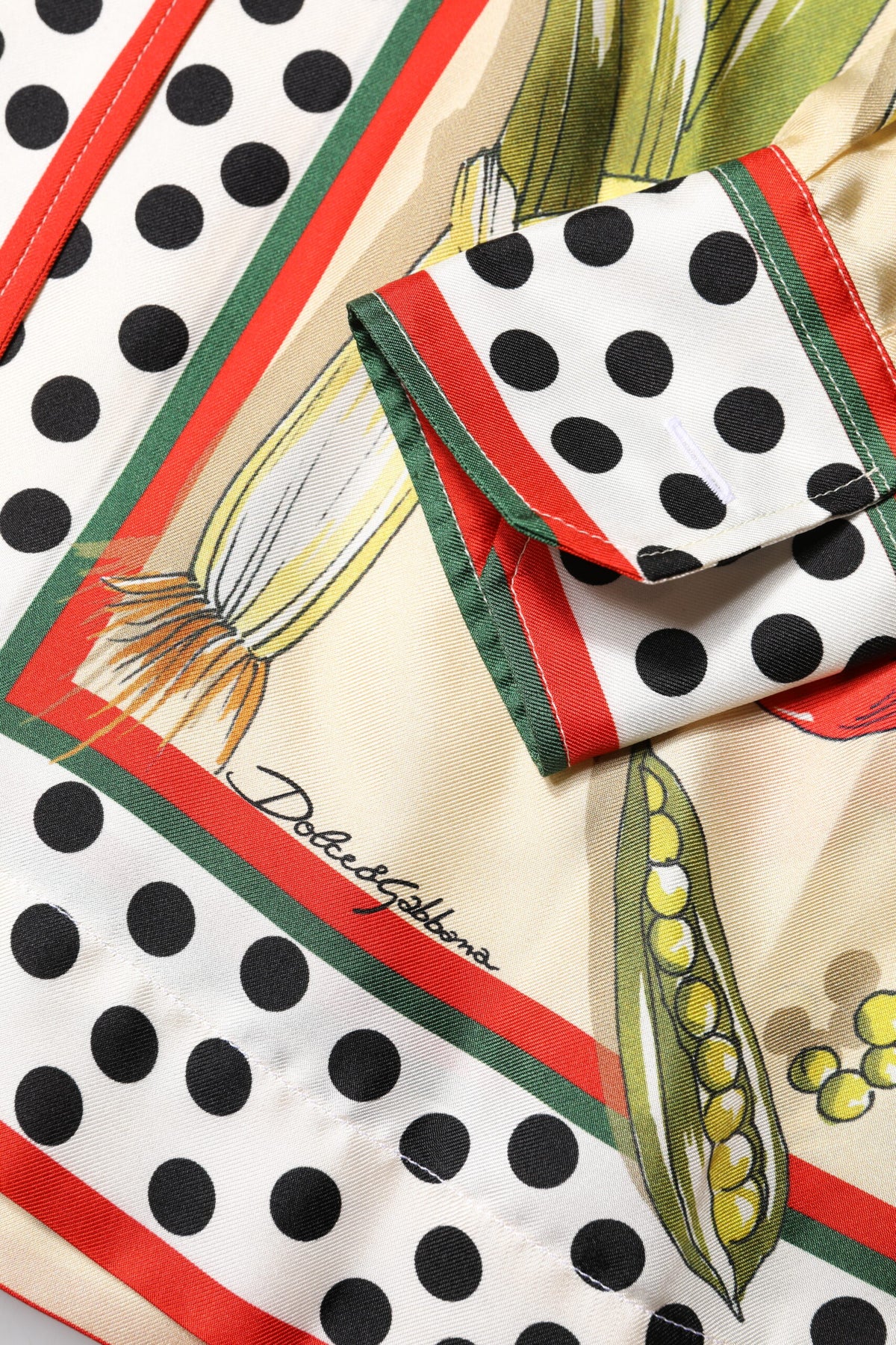 Elevate your wardrobe with the Dolce & Gabbana Multicolor Vegetables Silk Long Sleeves Top, a masterpiece of Italian craftsmanship that embodies timeless luxury and elegance.