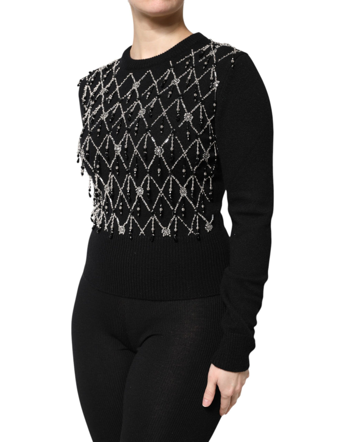 Elevate your wardrobe with the Dolce & Gabbana Black Cashmere Embellished Long Sleeves Top, a masterpiece of Italian craftsmanship that embodies luxury and sophistication.