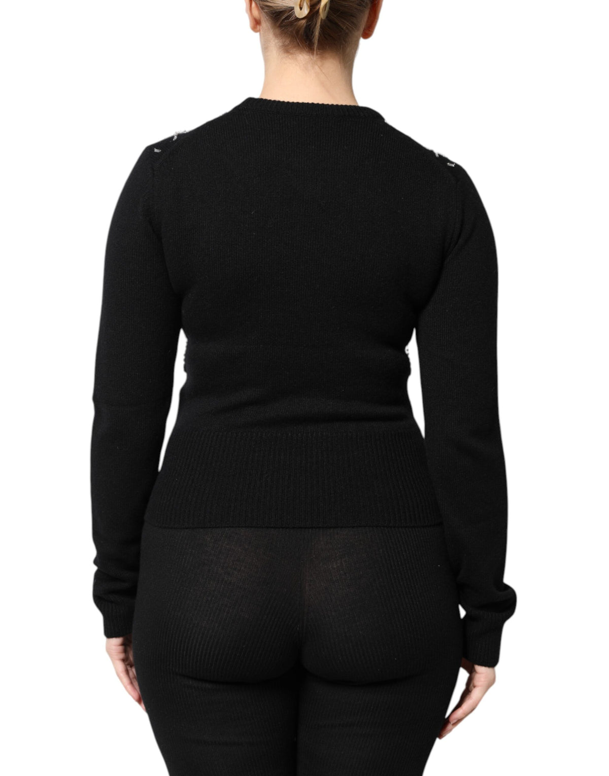Indulge in the exquisite Dolce & Gabbana Black Cashmere Embellished Long Sleeves Top, a masterpiece of Italian craftsmanship that embodies timeless elegance and sophisticated allure.