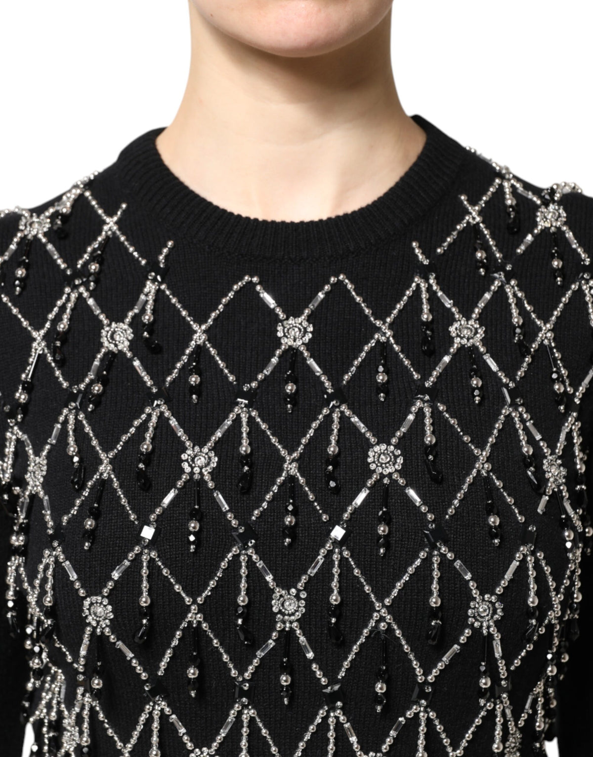 Experience the allure of Dolce & Gabbana's Black Cashmere Embellished Long Sleeves Top, a testament to Italian craftsmanship that redefines luxury and elegance.