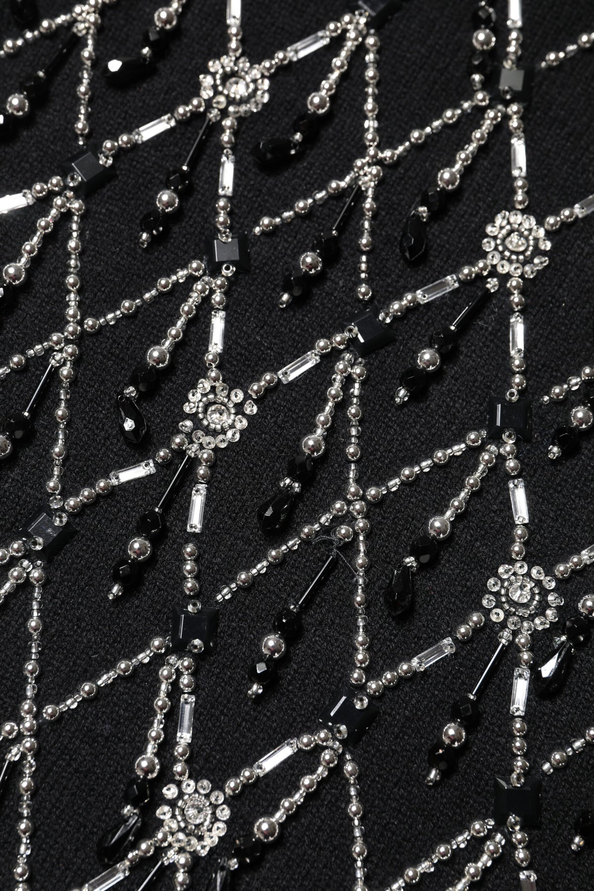 Indulge in the exquisite Dolce & Gabbana Black Cashmere Embellished Long Sleeves Top, a symbol of Italian craftsmanship that elevates your elegance and allure.