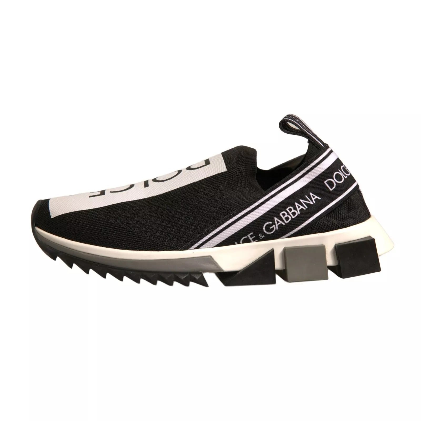 Experience the allure of Dolce & Gabbana's Black White Slip On Sorrento Sneakers, where luxurious stretch mesh meets exquisite Italian craftsmanship for timeless elegance.