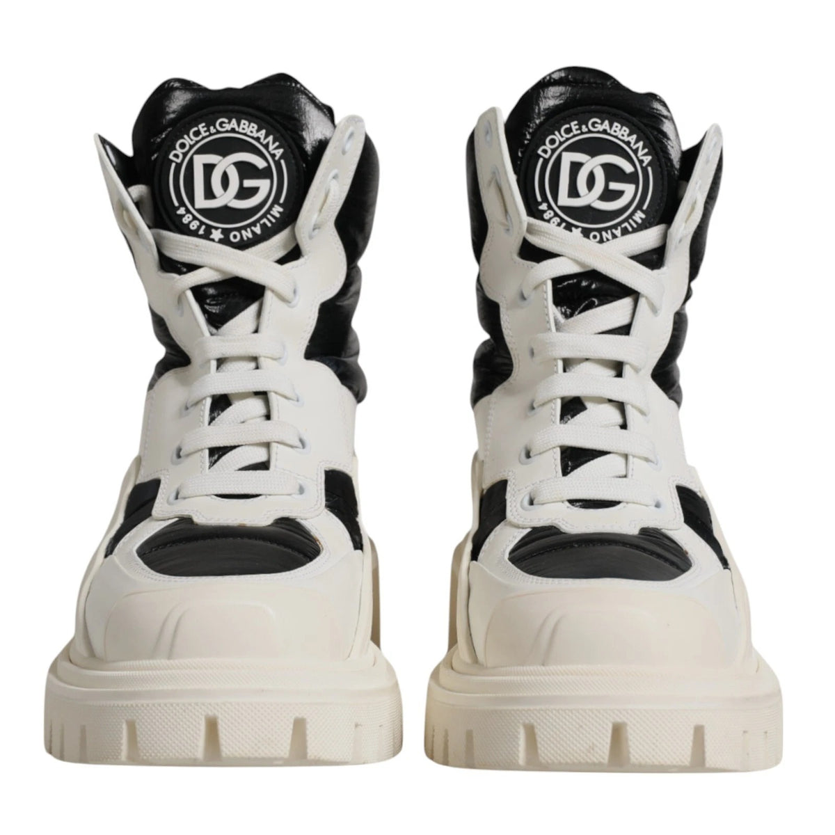 Elevate your style with Dolce & Gabbana's White Padded Mid Calf Lace Up Boots, a luxurious blend of Italian craftsmanship and exquisite materials that embody sophistication.