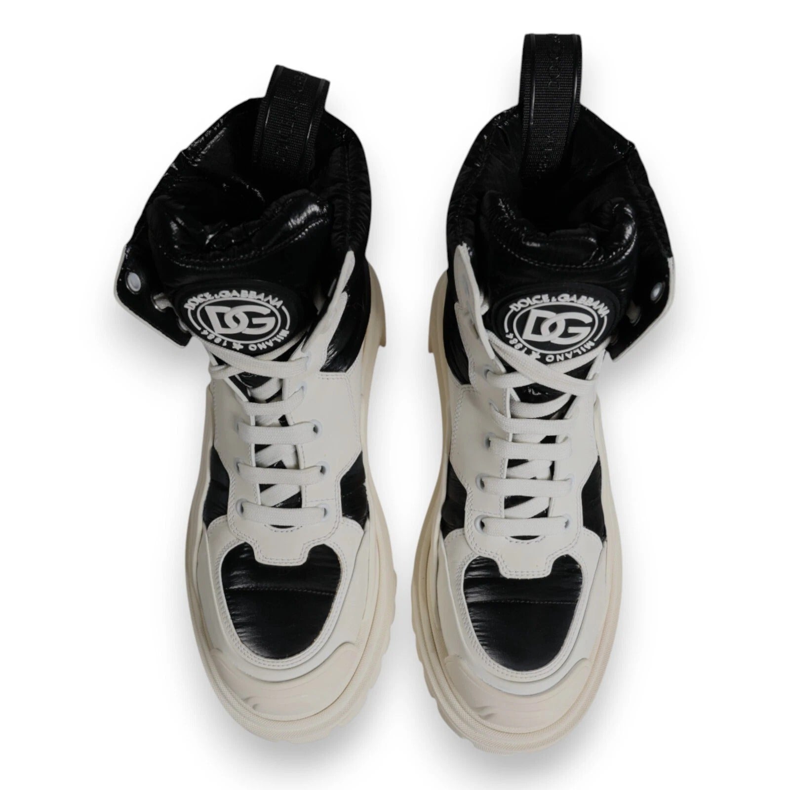 Elevate your style with Dolce & Gabbana's White Padded Mid Calf Lace Up Boots, where Italian craftsmanship meets luxurious comfort, perfect for the discerning individual.