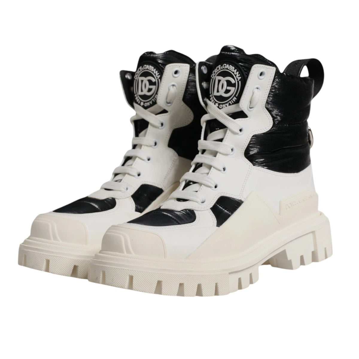 Indulge in the exquisite Dolce & Gabbana White Padded Mid Calf Lace Up Boots, crafted in Italy from premium materials, embodying luxury and sophistication for the discerning individual.